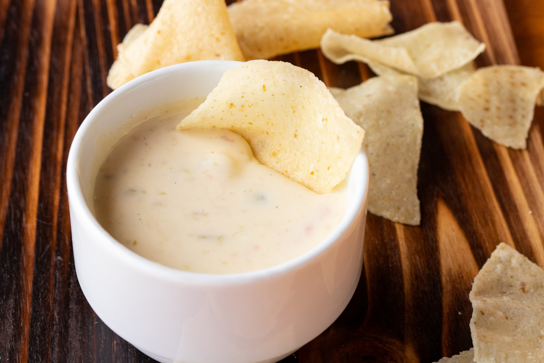 Order Chile con Queso Appetizer food online from Roja Mexican Grill store, Omaha on bringmethat.com