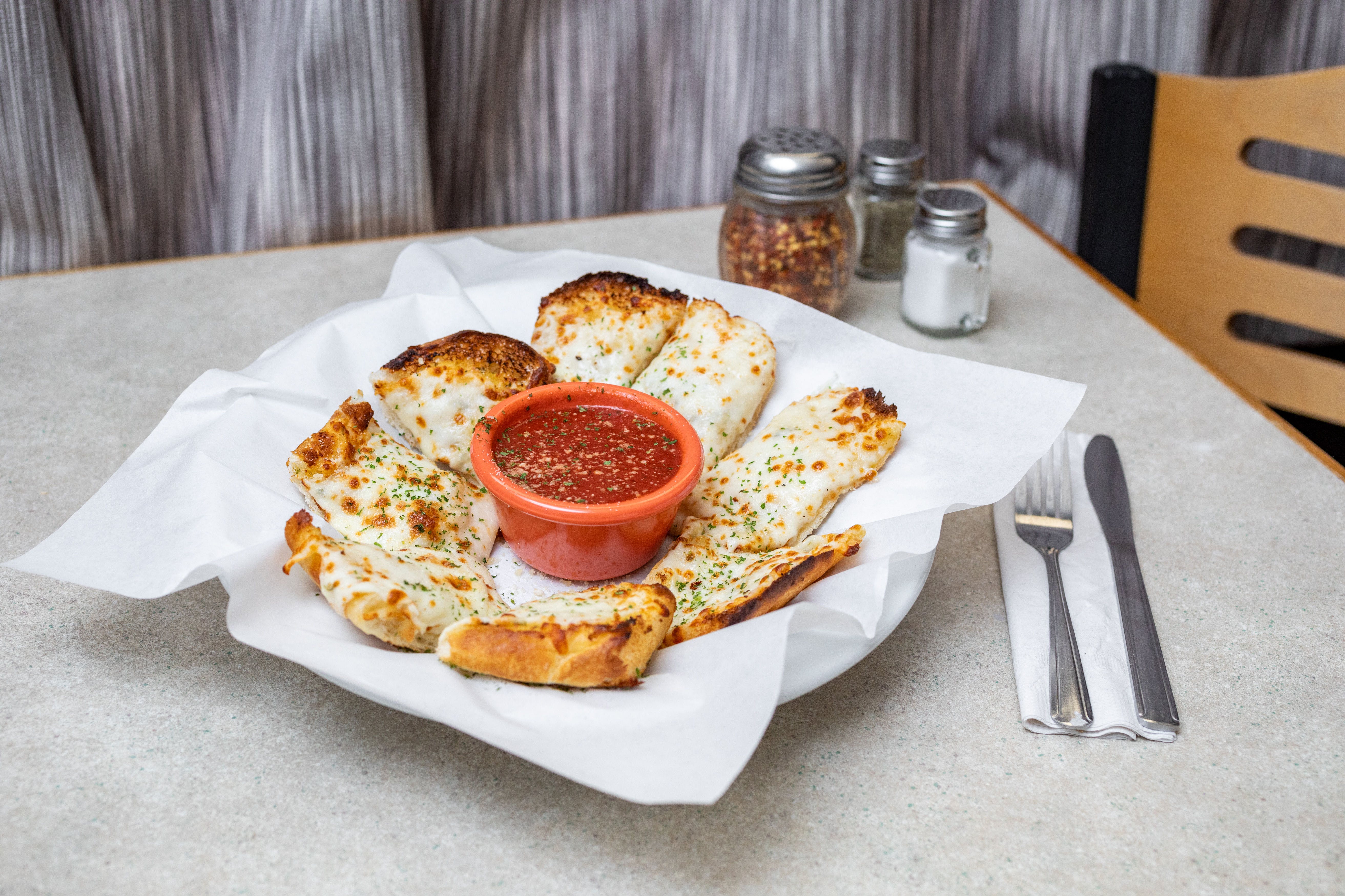 Order Garlic Bread with Cheese - Appetizer food online from Saucy's Pizza store, Littleton on bringmethat.com