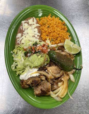 Order Carne Asada Torta $16.50 food online from Los Chicos Mexican Restaurant store, Greensboro on bringmethat.com