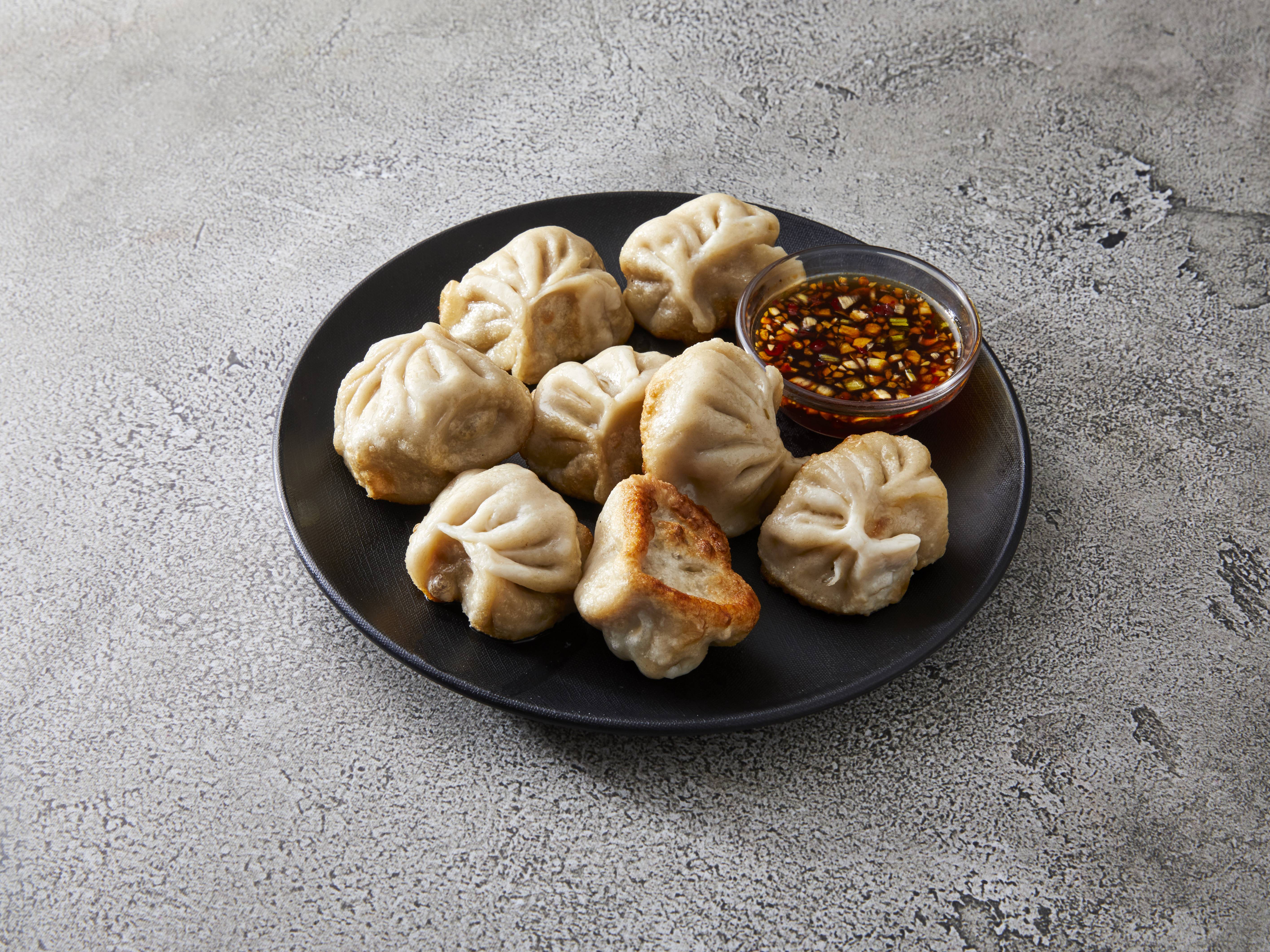 Order 8 Dumplings food online from Ming Garden store, Champaign on bringmethat.com