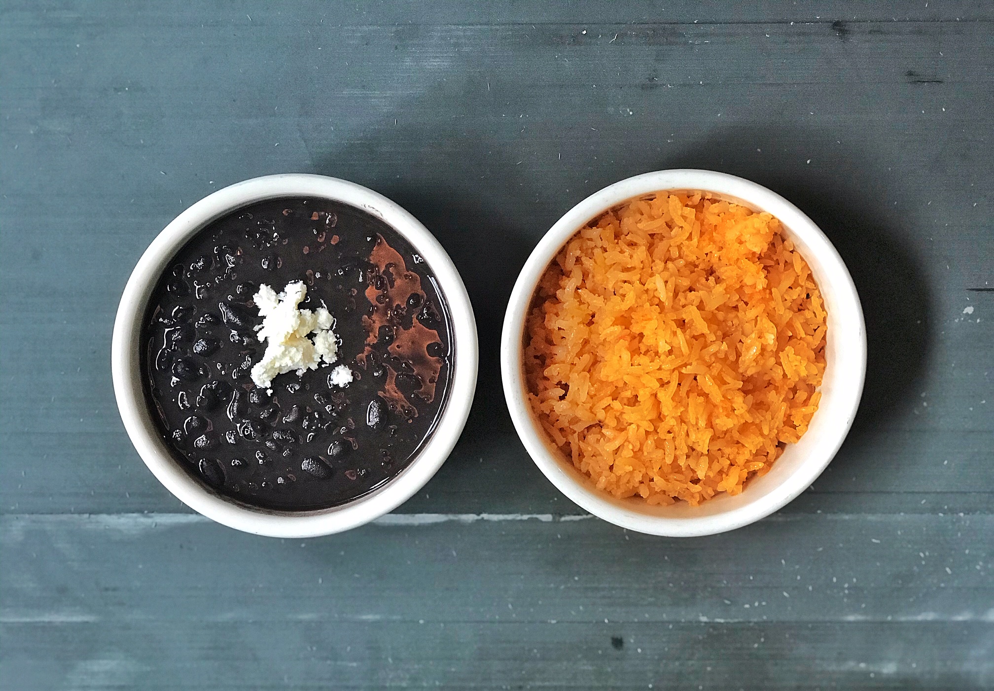 Order Rice & Beans food online from ESQUELETO TAQUERIA store, Brooklyn on bringmethat.com