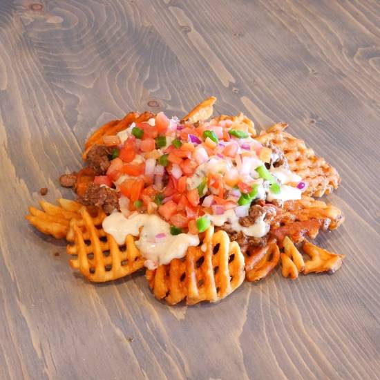 Order Nacho Fries food online from Tacoholics store, Point Pleasant on bringmethat.com
