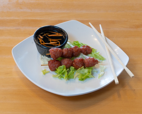Order A6. Grilled Pork BBQ Meatballs food online from Que Huong store, Plano on bringmethat.com