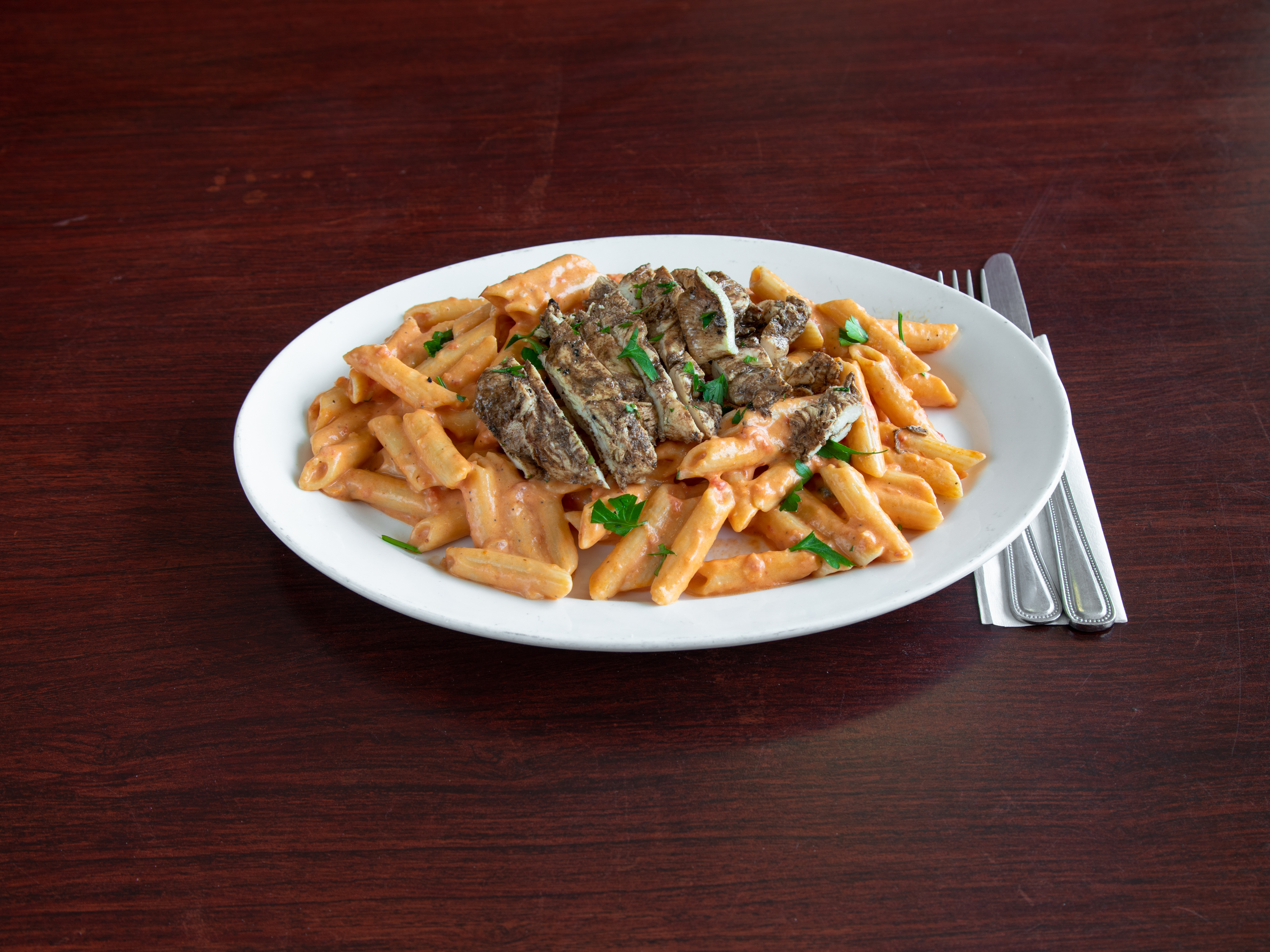 Order Spicy Penne alla Vodka with Grilled Chicken food online from Jerry Pizza store, Jersey City on bringmethat.com