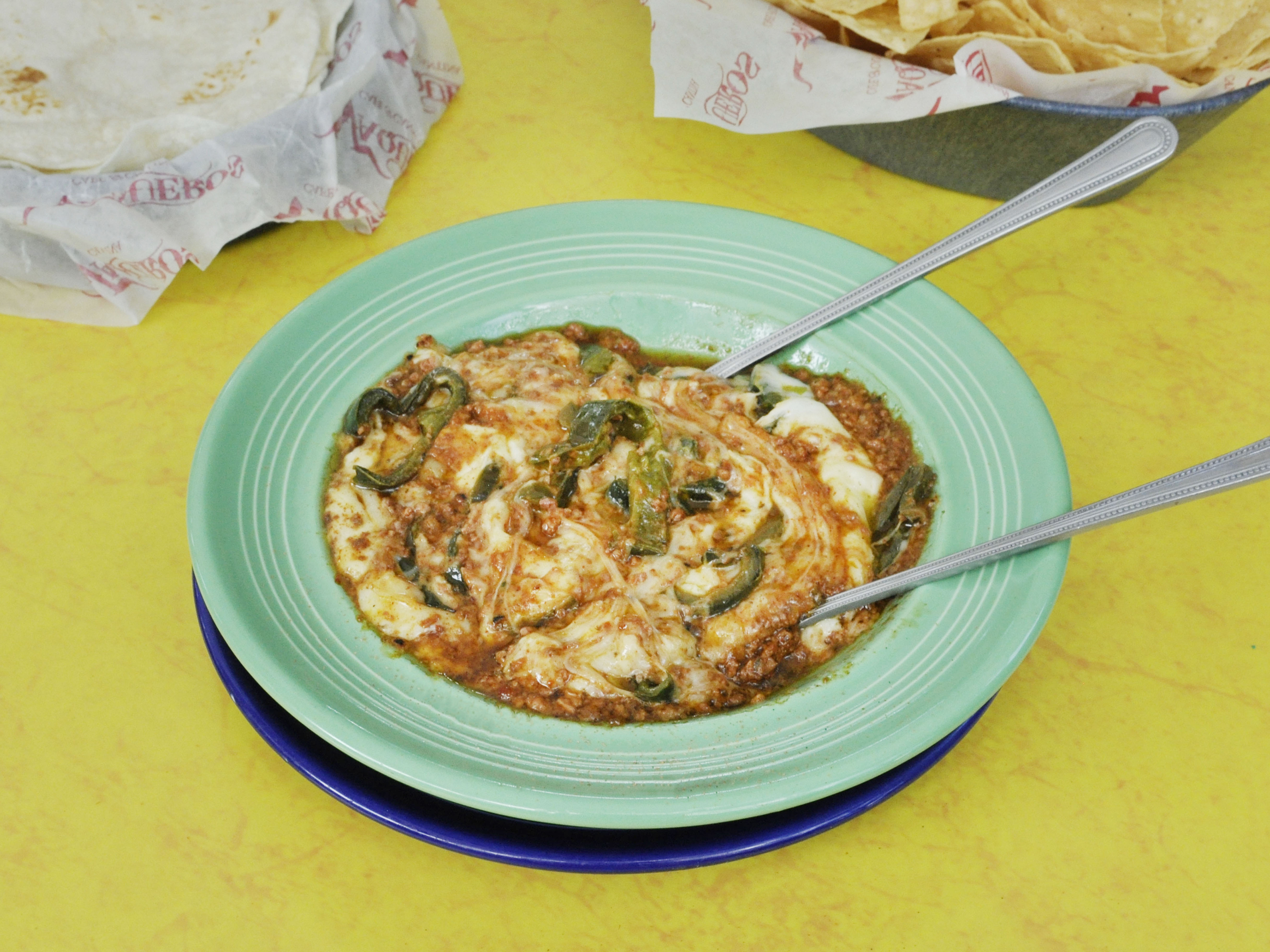 Order Queso Flameado food online from Vaqueros Cafe & Cantina store, Austin on bringmethat.com