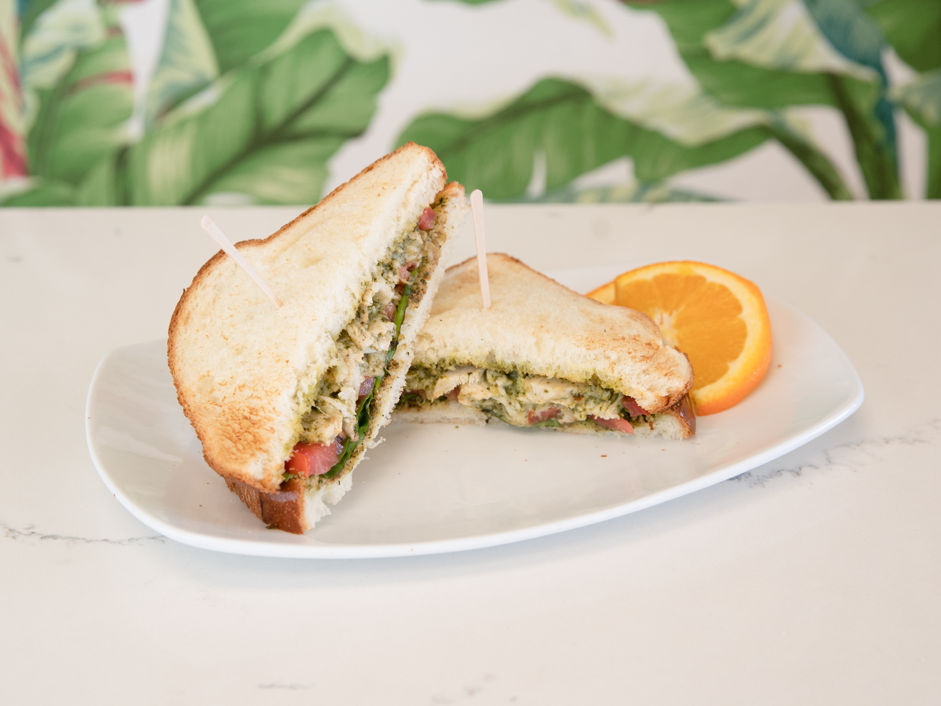 Order Chicken Pesto Sandwich food online from Classics Flowers Cafe Bakery store, Cypress on bringmethat.com