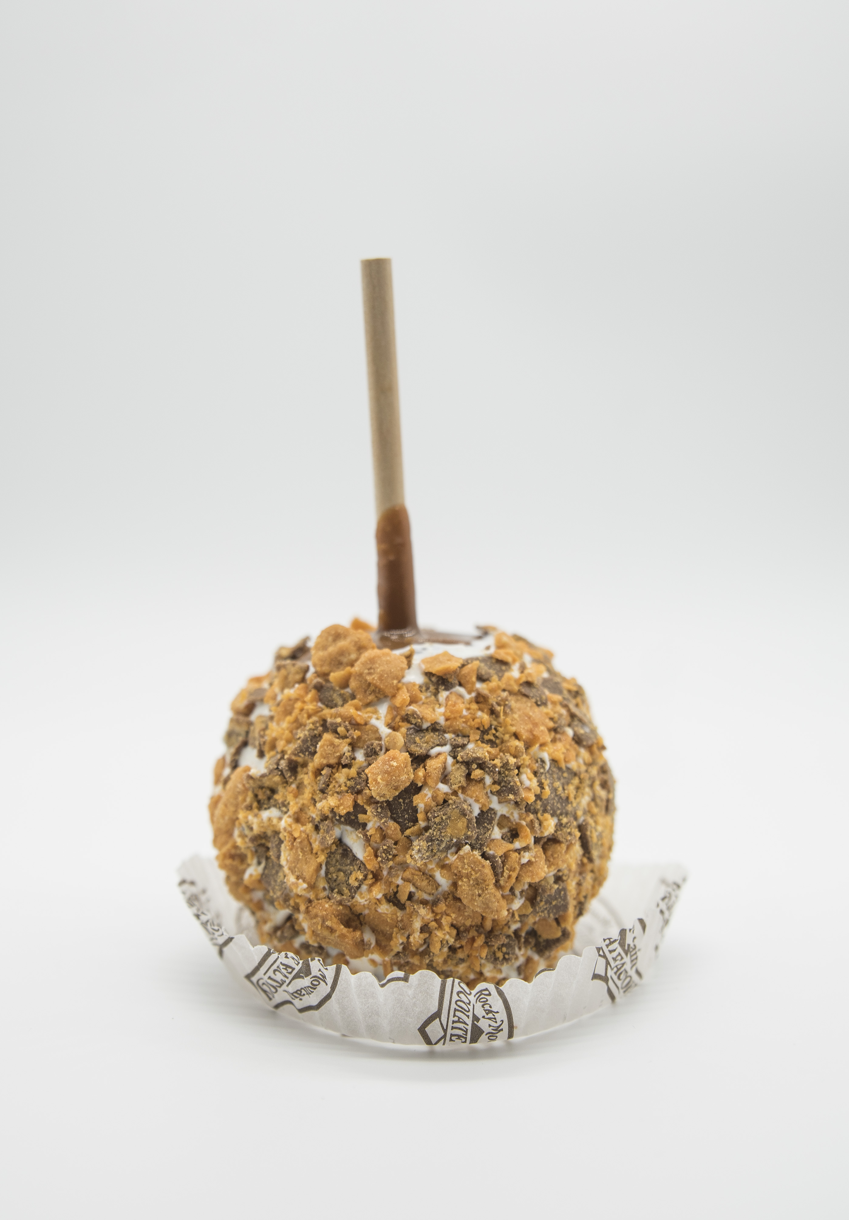 Order Butterfinger Caramel Apple food online from Rocky Mountain Chocolate Factory store, Fresno on bringmethat.com