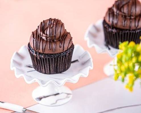 Order Swiss Dark Chocolate cupcake food online from Layers bakeshop store, Westbury on bringmethat.com