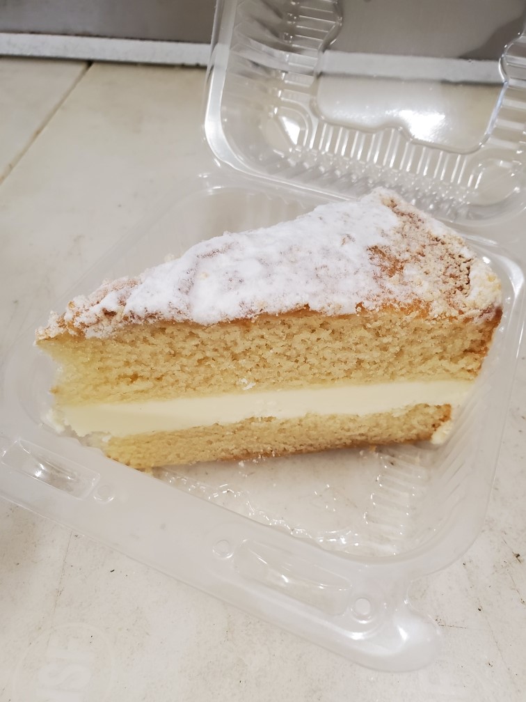 Order Lemon Italian Cream Cake food online from Via Sofia's store, Cedar Rapids on bringmethat.com