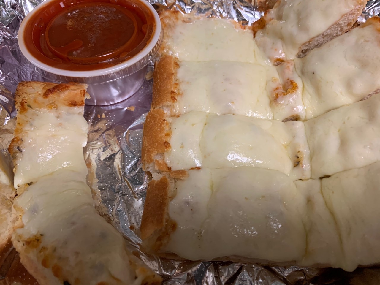 Order Garlic Bread with Cheese food online from Nancy Pizza store, Niles on bringmethat.com