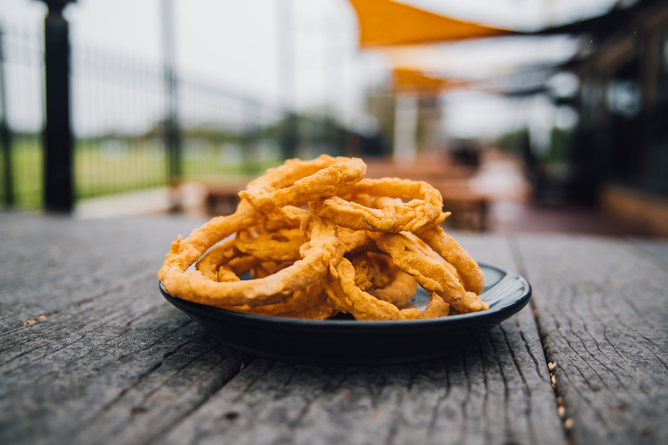 Order Onion Rings food online from Walk-On Sports Bistreaux store, Broussard on bringmethat.com