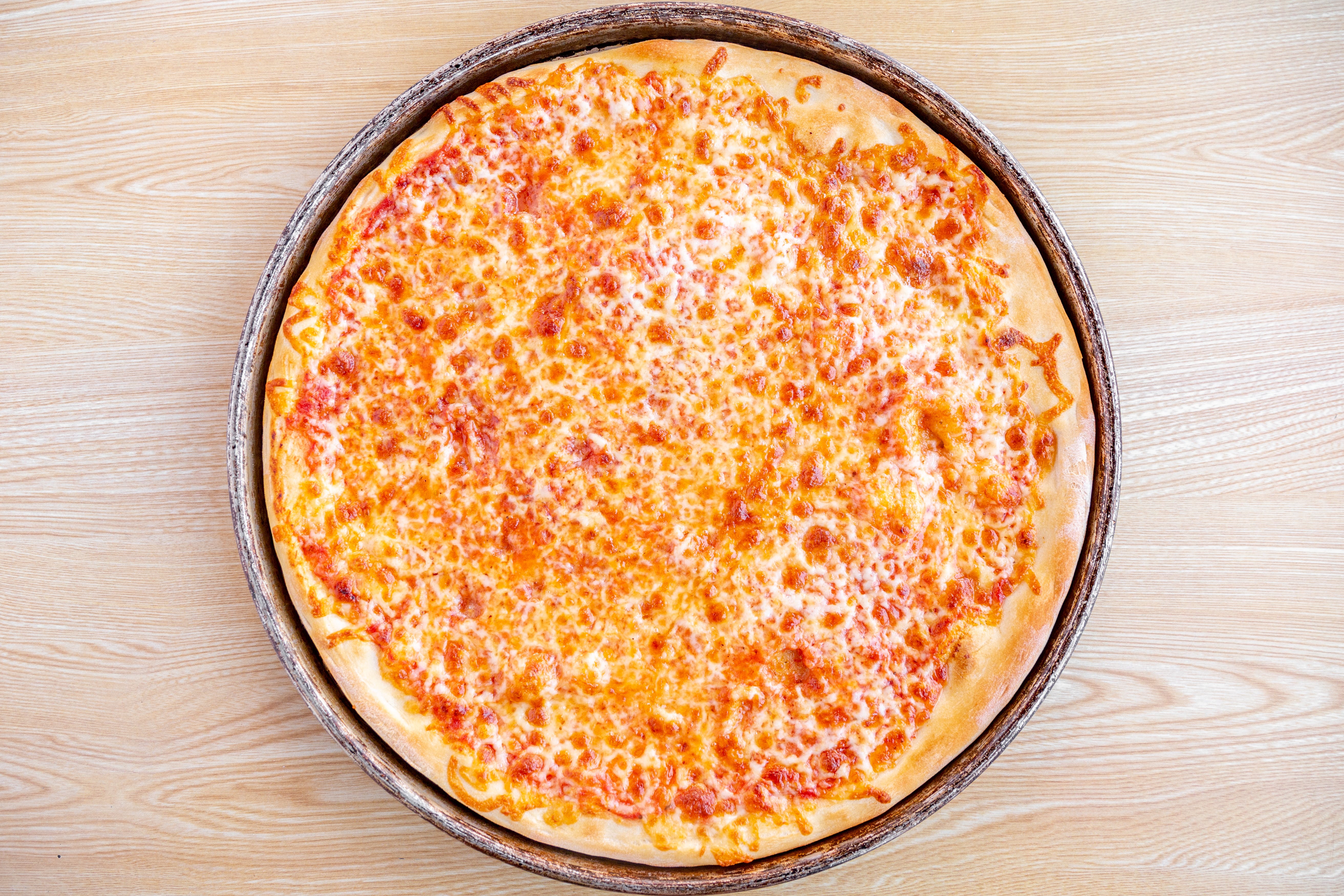 Order Plain Cheese Pizza - Small food online from Uxbridge House of Pizza store, Uxbridge on bringmethat.com