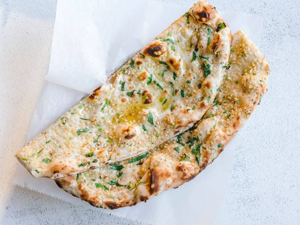 Order Garlic Naan food online from Mini Mott All Day store, Chicago on bringmethat.com