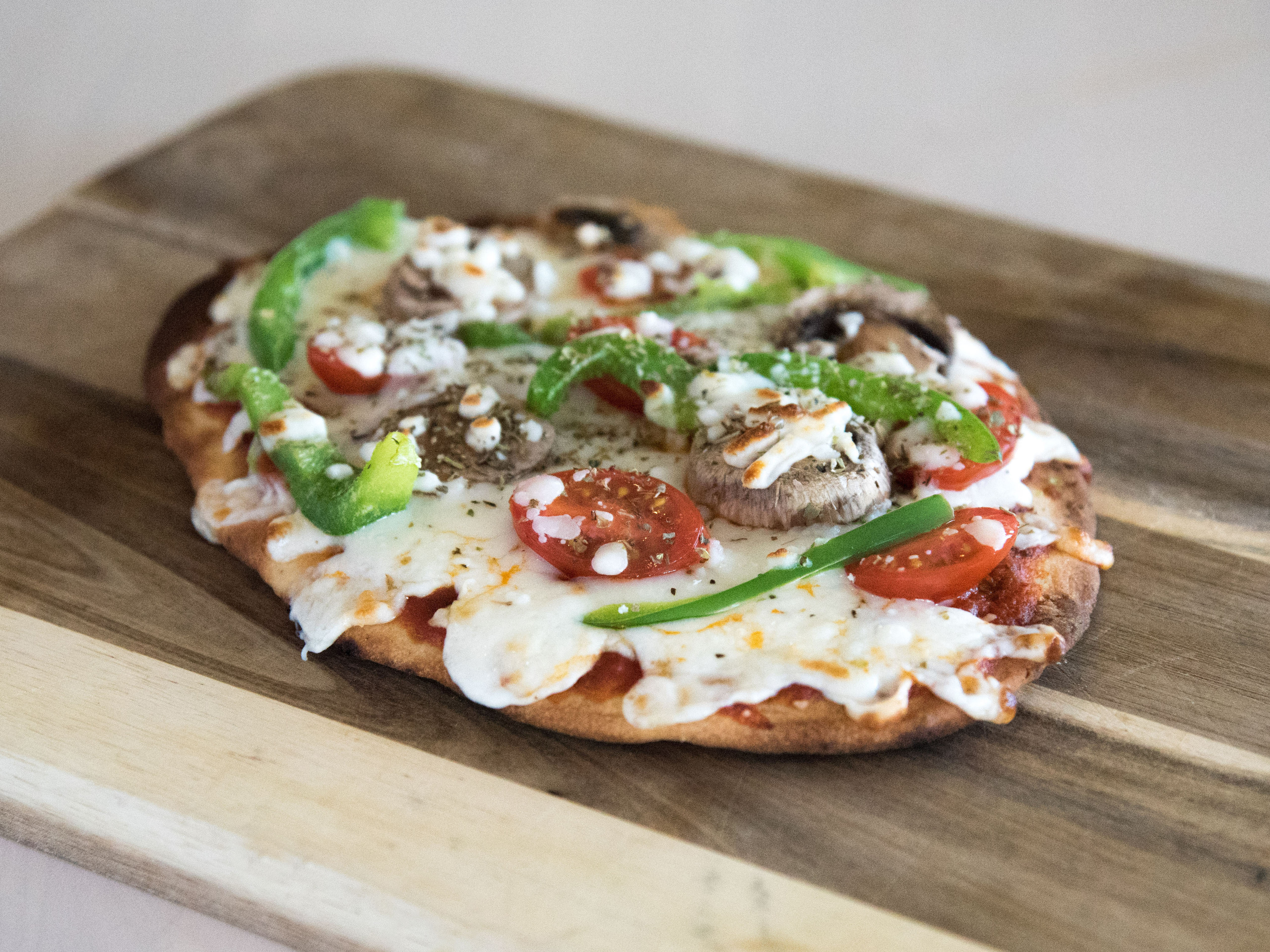 Order Flat Bread Pizza food online from The Healthy Food Cafe store, Indianapolis on bringmethat.com