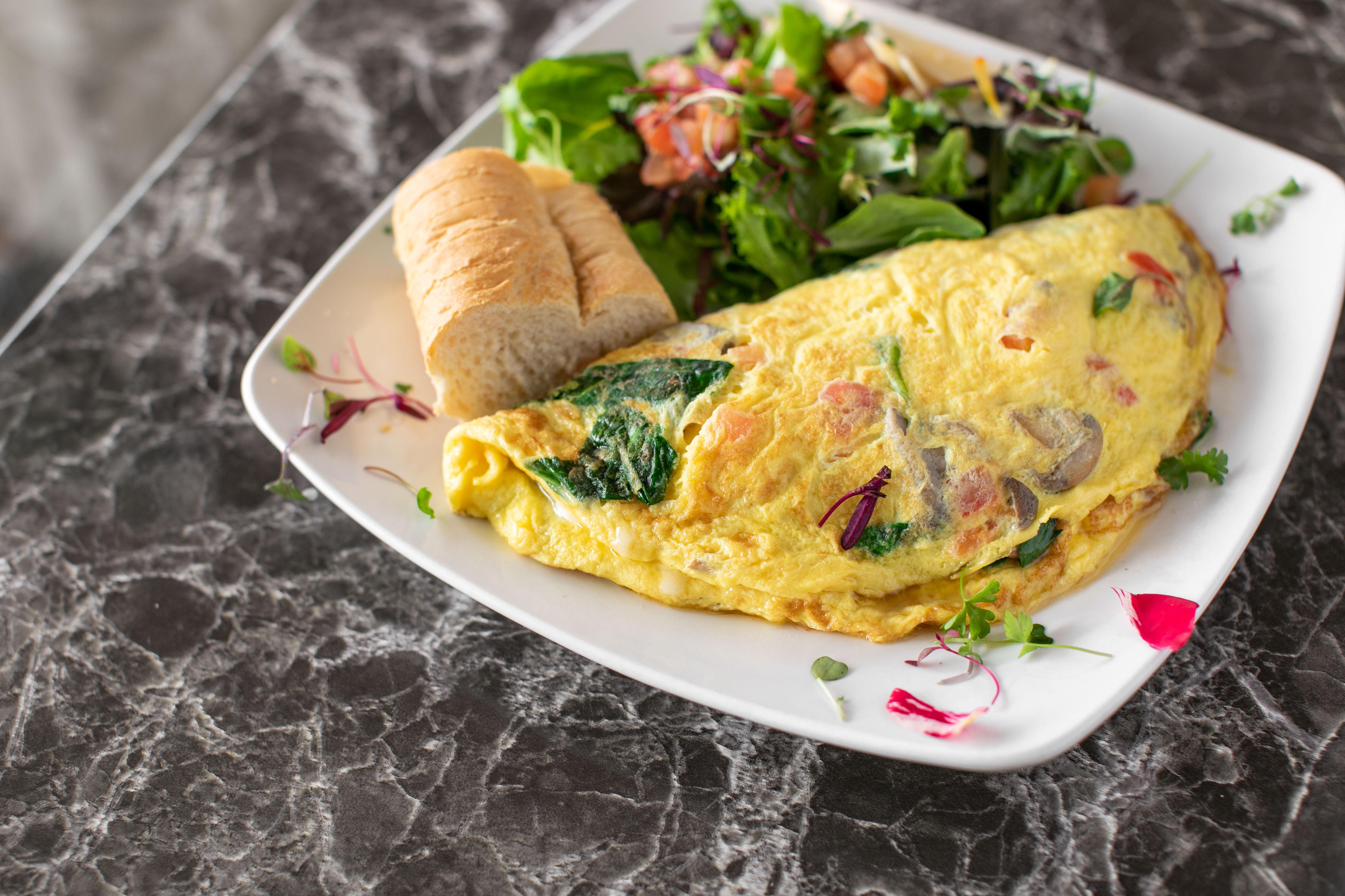 Order Tomato, Spinach & Cheese Omelette food online from Rendez Vous store, Corona Del Mar on bringmethat.com