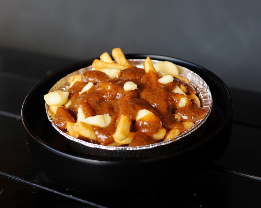 Order DWC Poutine food online from Detroit Wing Company store, Northville on bringmethat.com