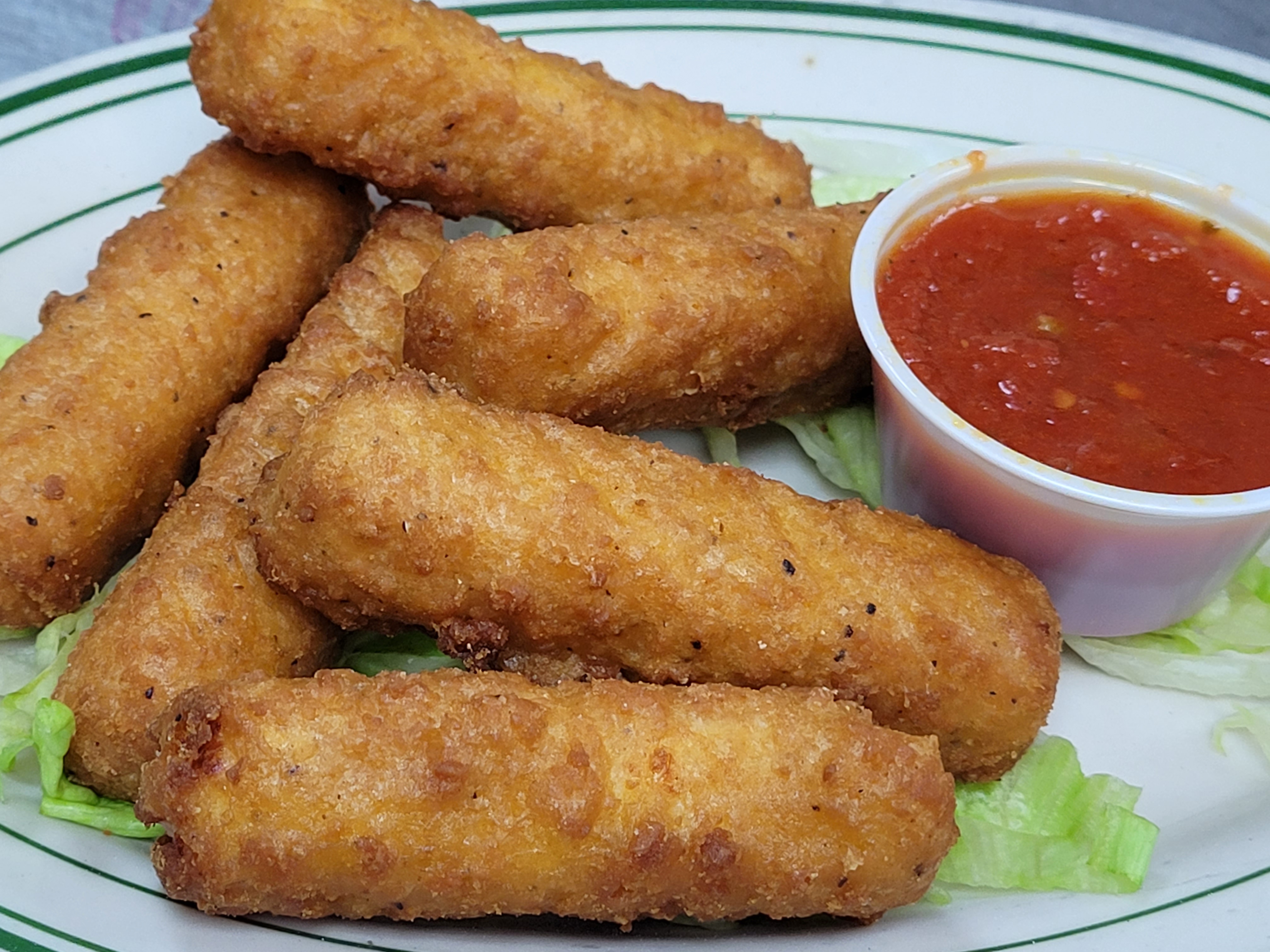 Order Mozzarella Sticks food online from Illianos Pizza store, Clemmons on bringmethat.com
