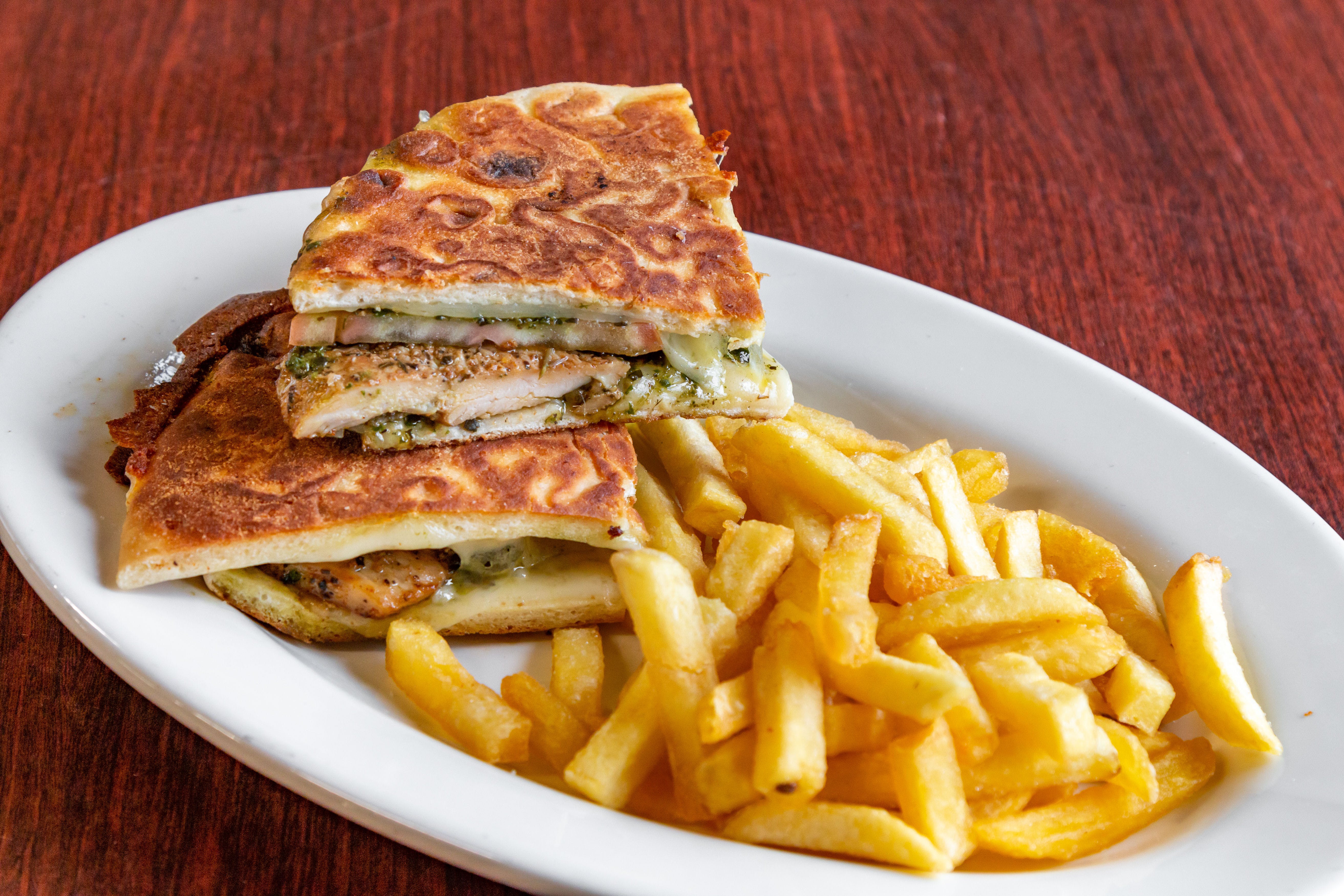 Order Chicken Pesto Panini - Paninis food online from Saybrook Pizza & Restaurant store, Old Saybrook on bringmethat.com