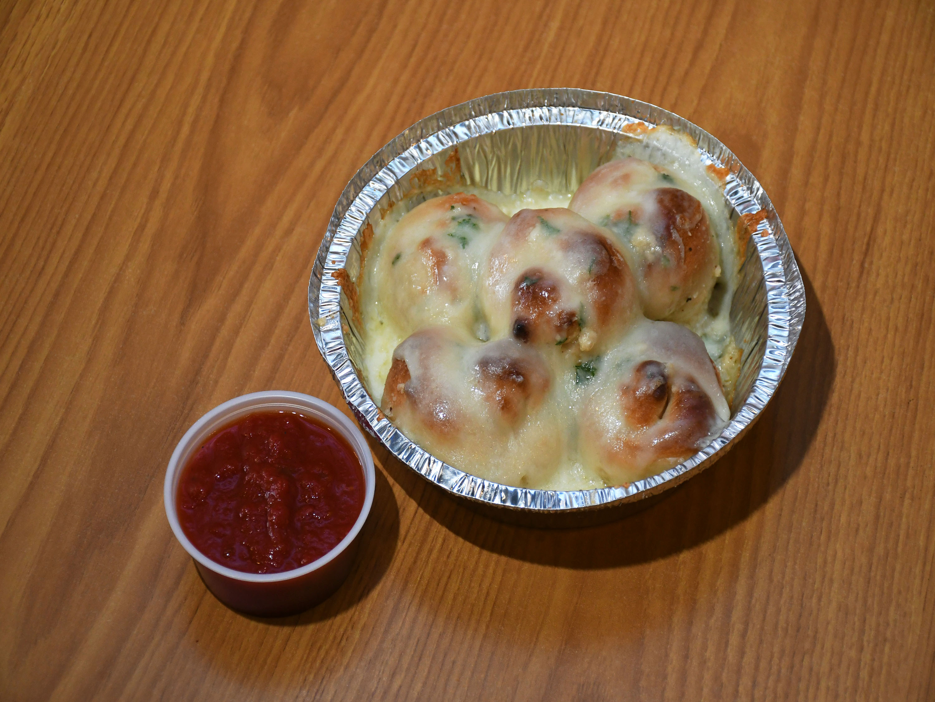 Order Garlic Knots with Cheese food online from Taste Of New York Pizza store, West Des Moines on bringmethat.com