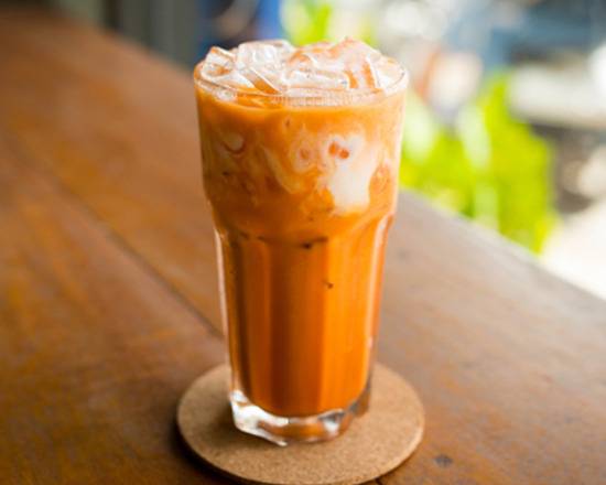 Order Thai Iced Tea food online from The Cure Kitchen & Bar store, Huntington Beach on bringmethat.com