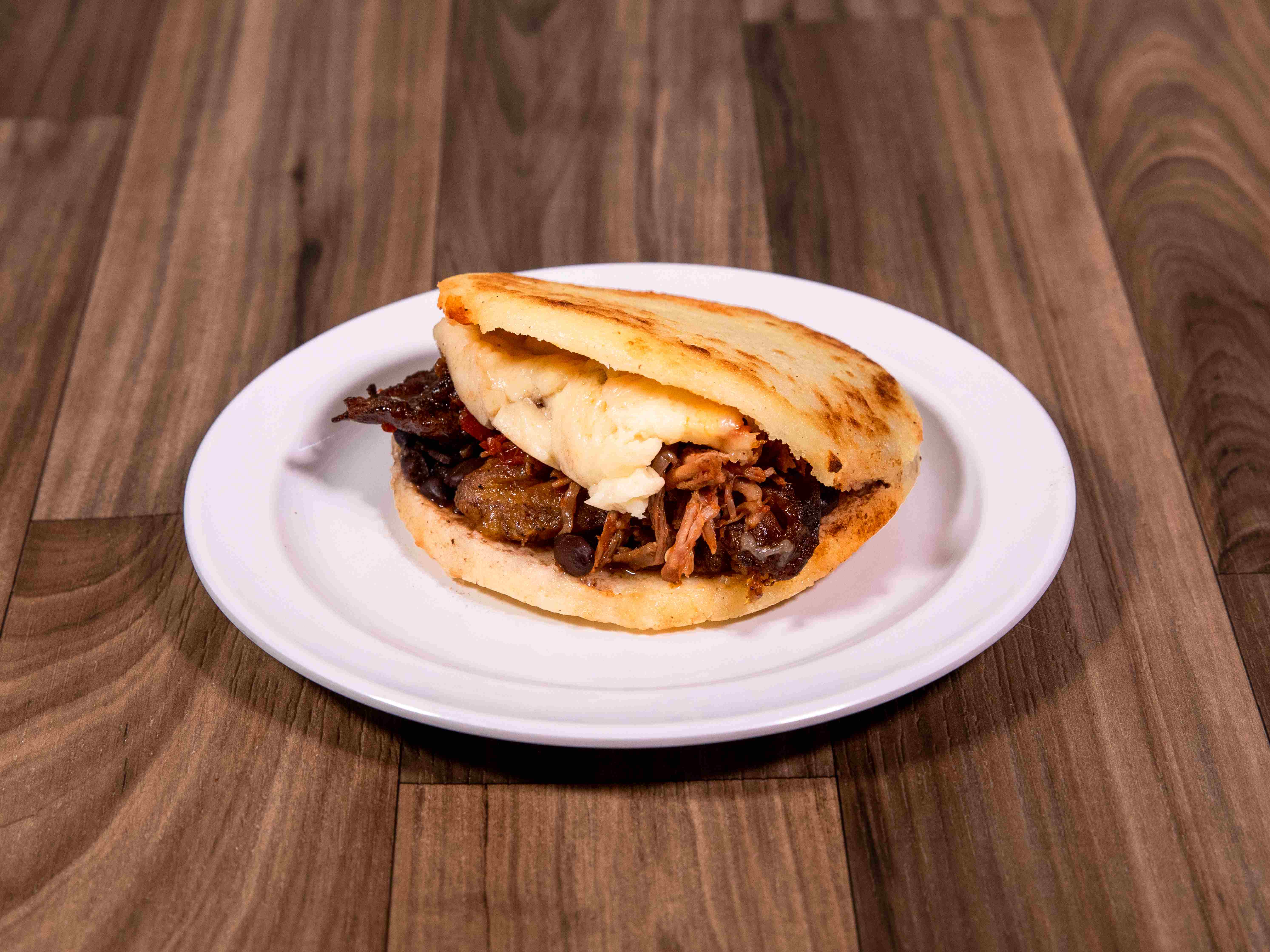 Order Arepa Perico food online from Zaguan Latin Cafe & Bakery store, Dallas on bringmethat.com
