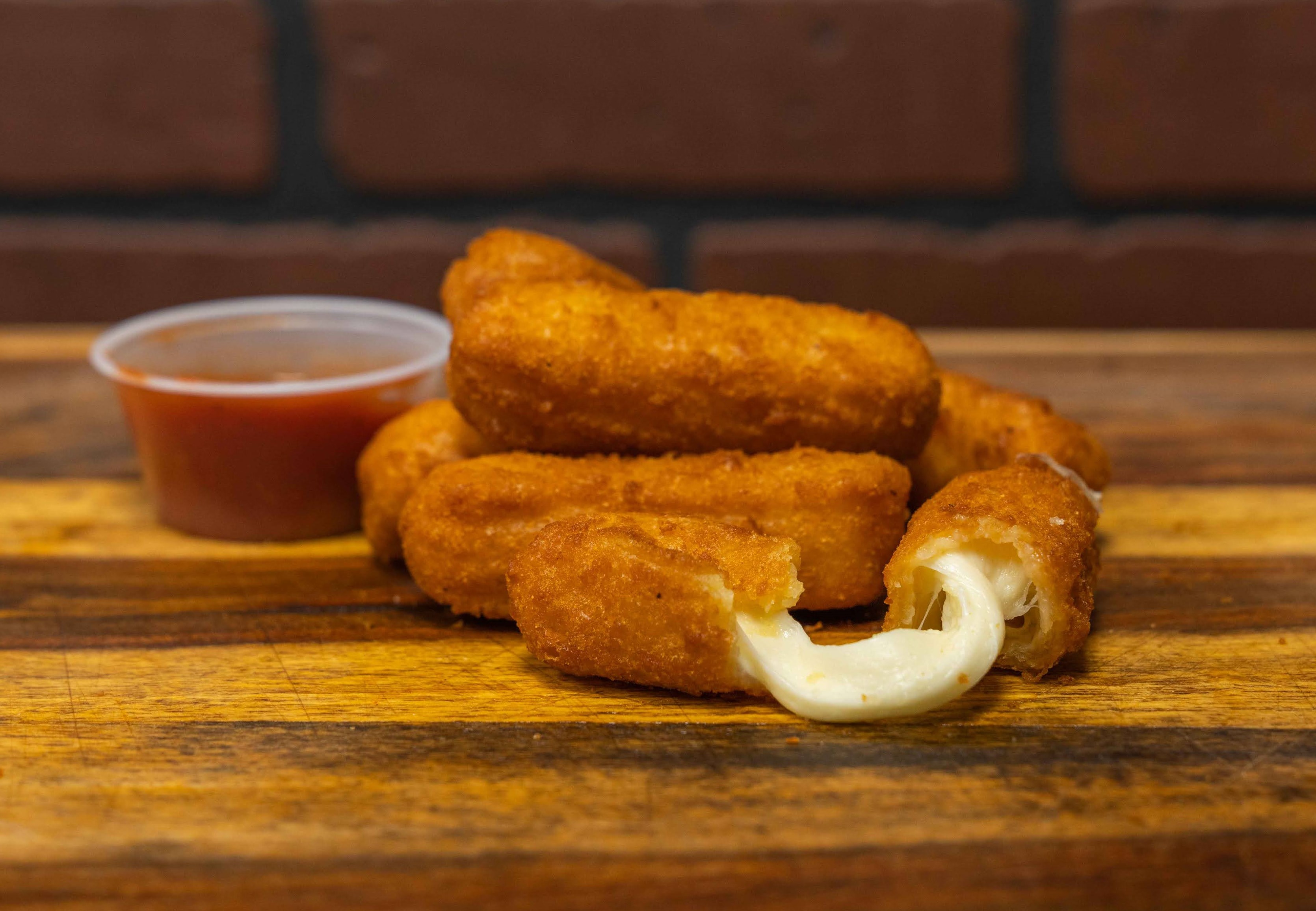 Order Mozzarella Sticks food online from Big Belly Que store, Smithtown on bringmethat.com