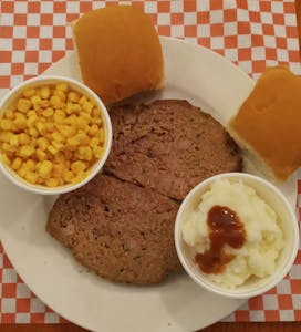 Order Meatloaf/Gravy/2 Sides food online from Pluto's Cafe store, Groesbeck on bringmethat.com