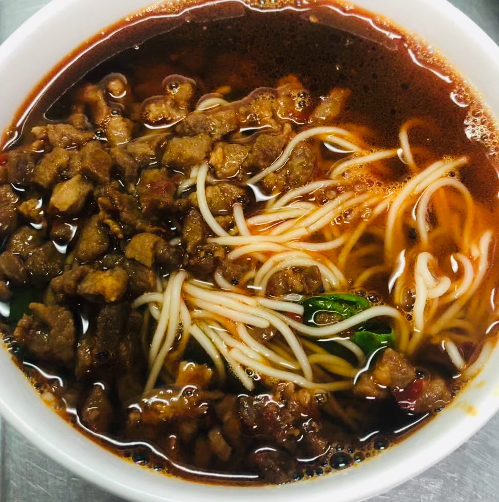 Order Shanghainese Spicy Pork Noodles in Soup food online from The Bund store, Forest Hills on bringmethat.com