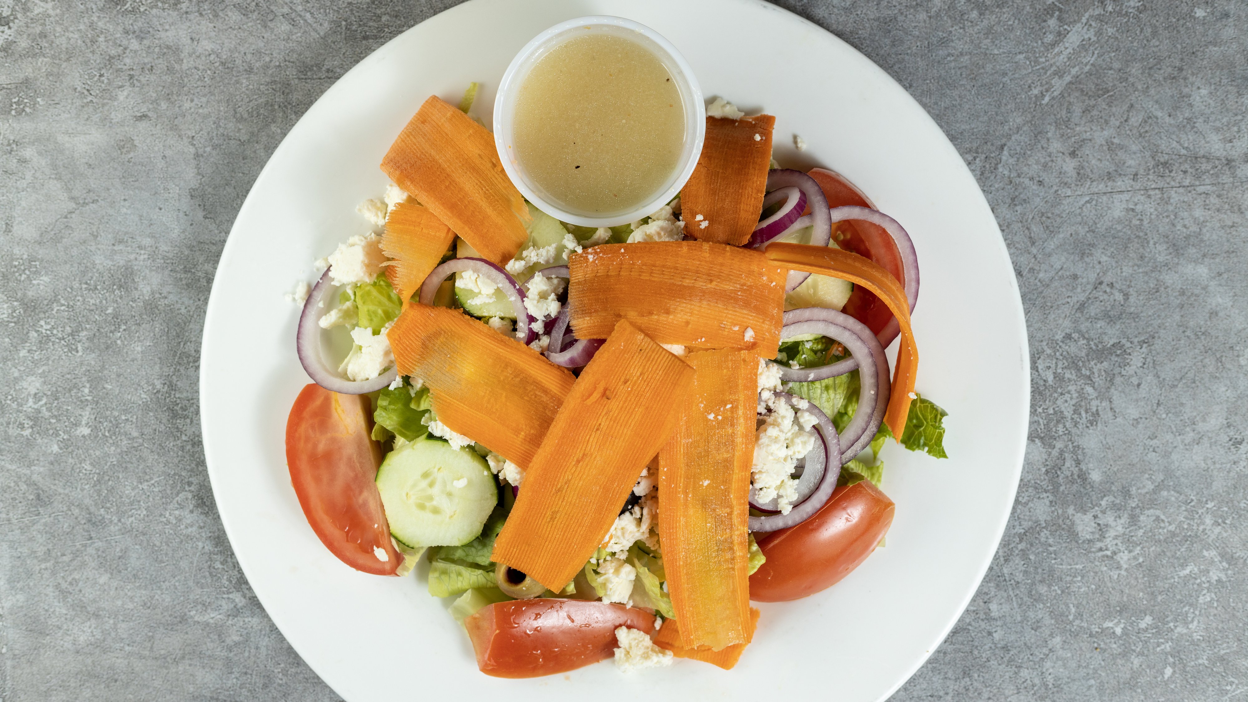 Order Greek Salad food online from La Regina Pizza store, Lynbrook on bringmethat.com