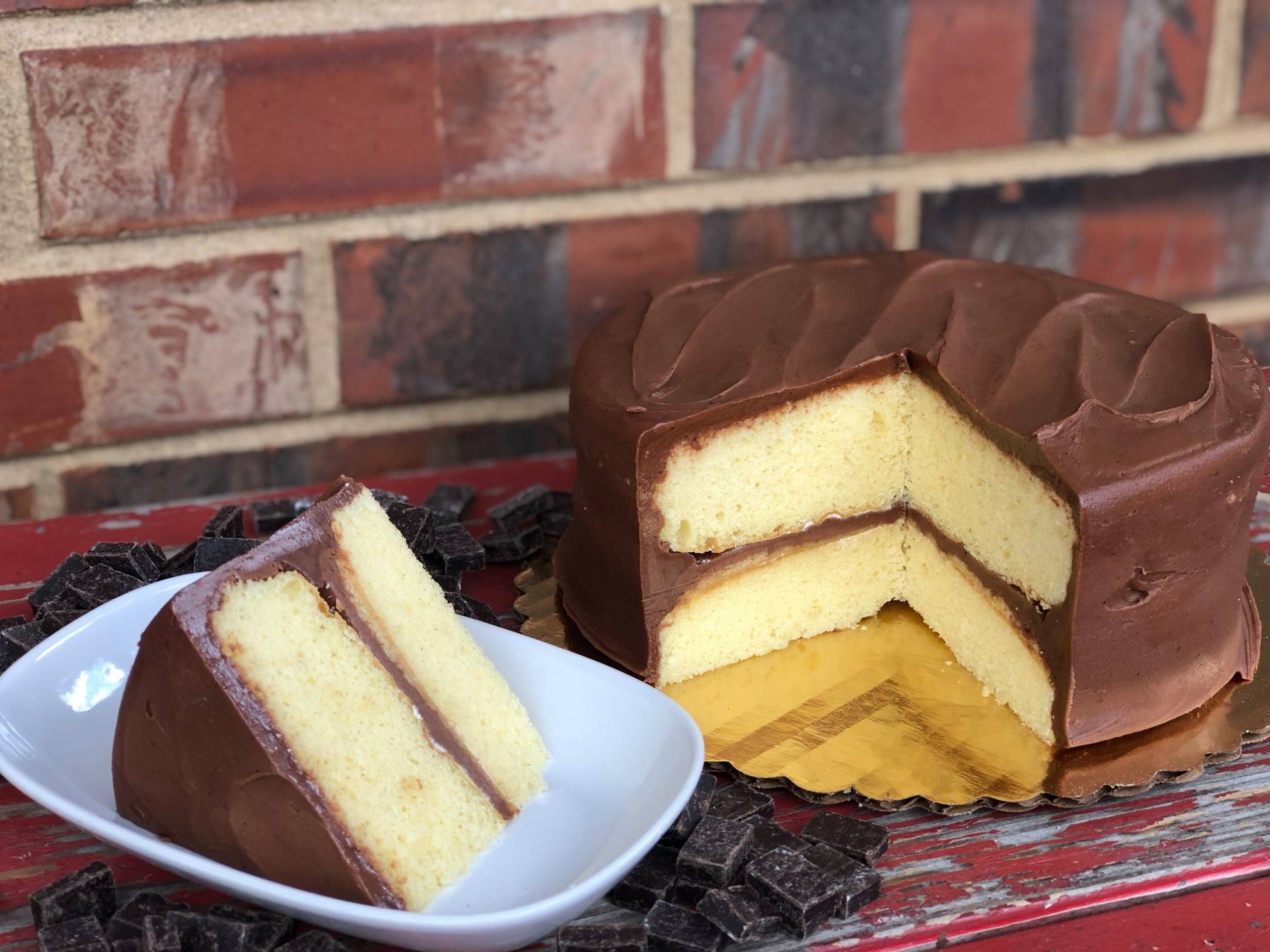 Order Yellow Layer Cake with Chocolate Fudge Icing food online from Mcentyre's Bakery store, Dallas on bringmethat.com