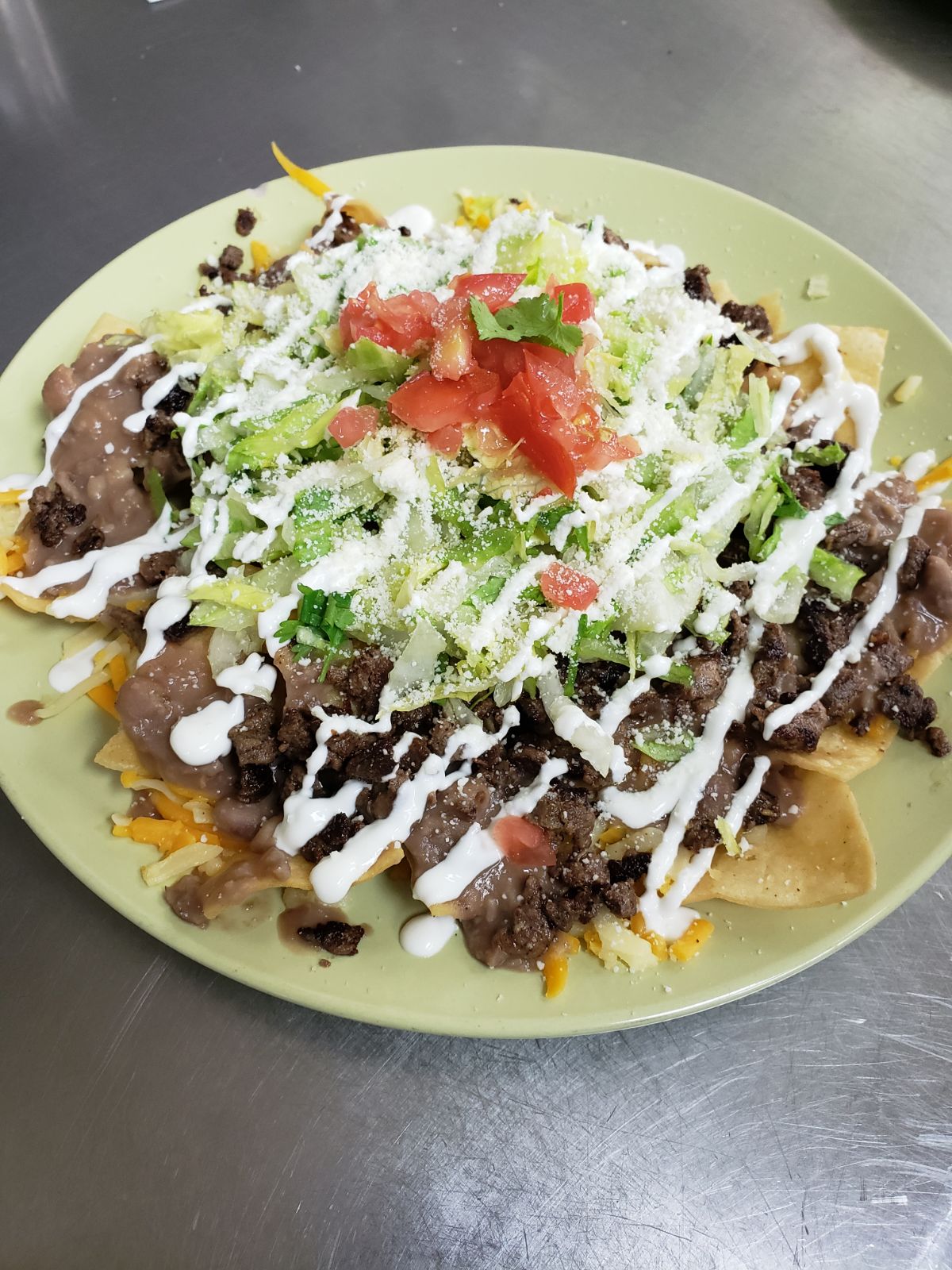 Order Nachos Deluxe food online from Aminas Cafe store, Bronx on bringmethat.com