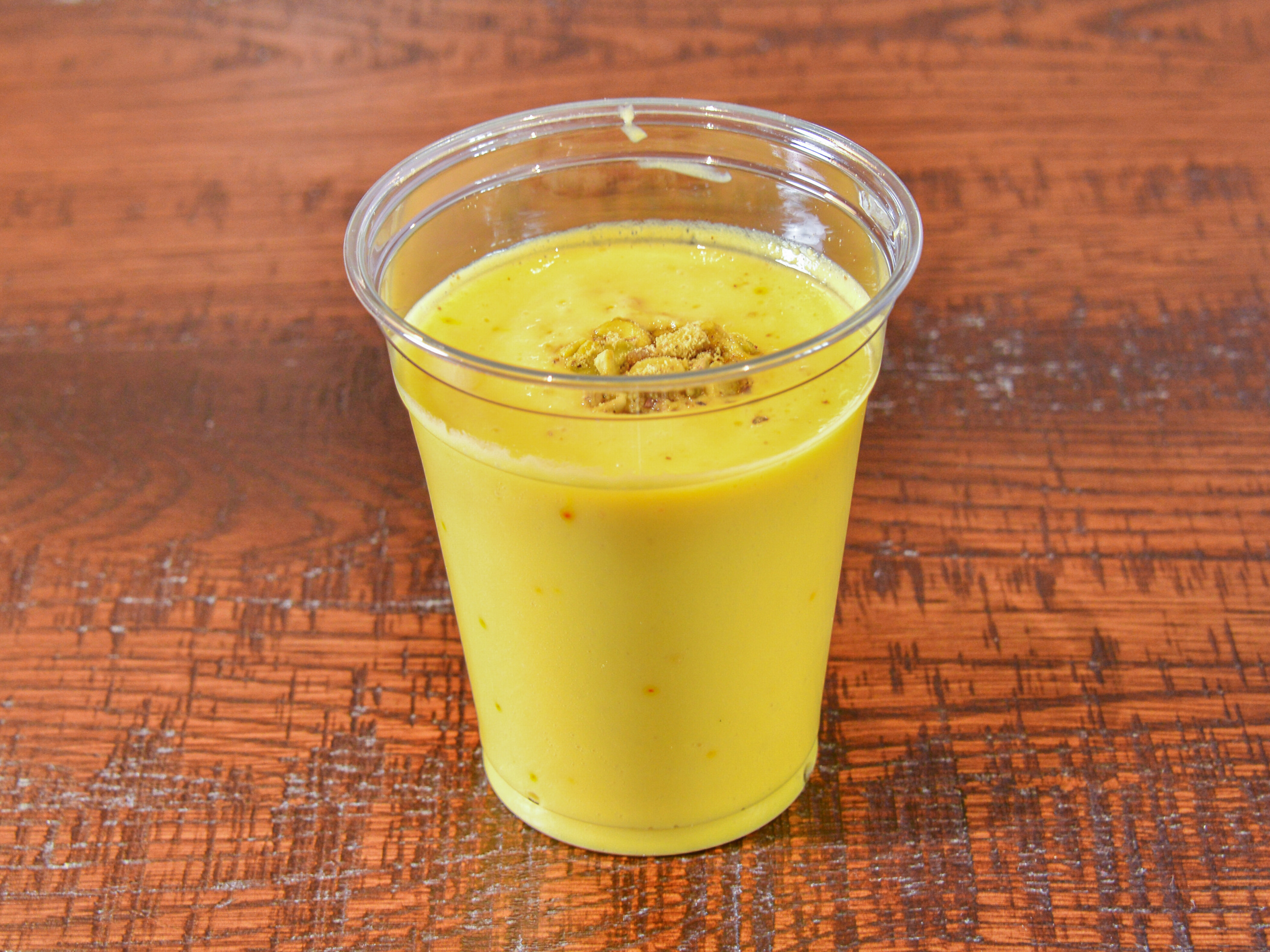 Order Mango Lassi food online from Rollz Rice Indian Kitchen store, Lewis Center on bringmethat.com