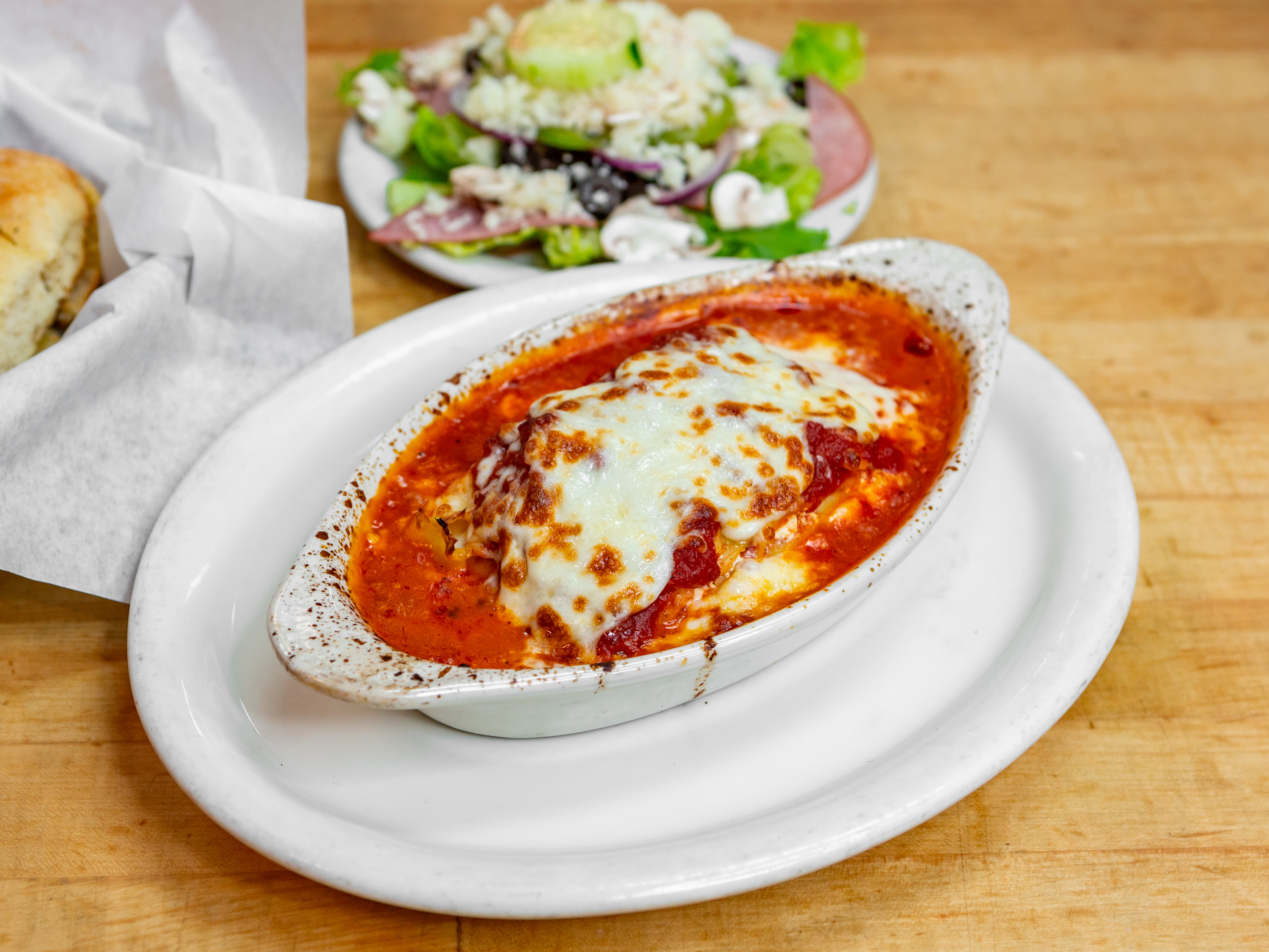 Order Baked Lasagna Dinner food online from Guidos Pizza store, Anchorage on bringmethat.com