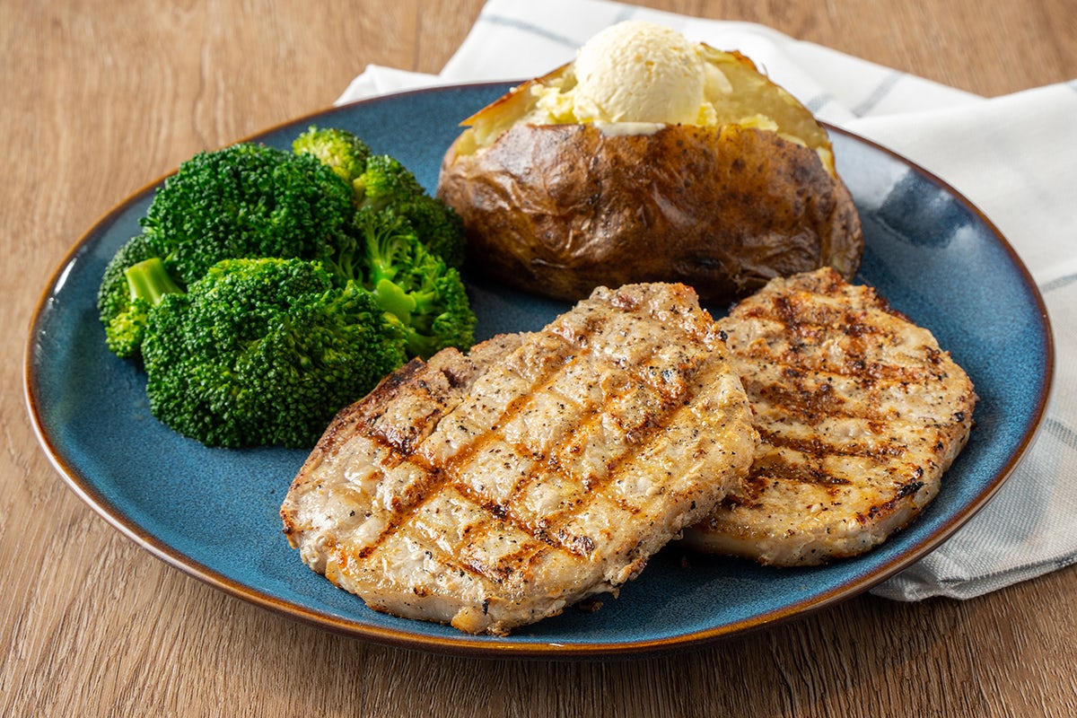 Order Mesquite-Grilled Pork Chops food online from Logan's Roadhouse store, Alexandria on bringmethat.com