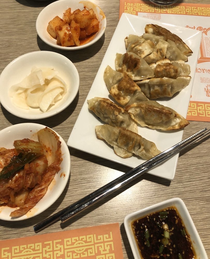 Order 10 Fried Dumplings food online from Charlie Kangs Chinese & Korean Cuisine  store, East Lansing on bringmethat.com