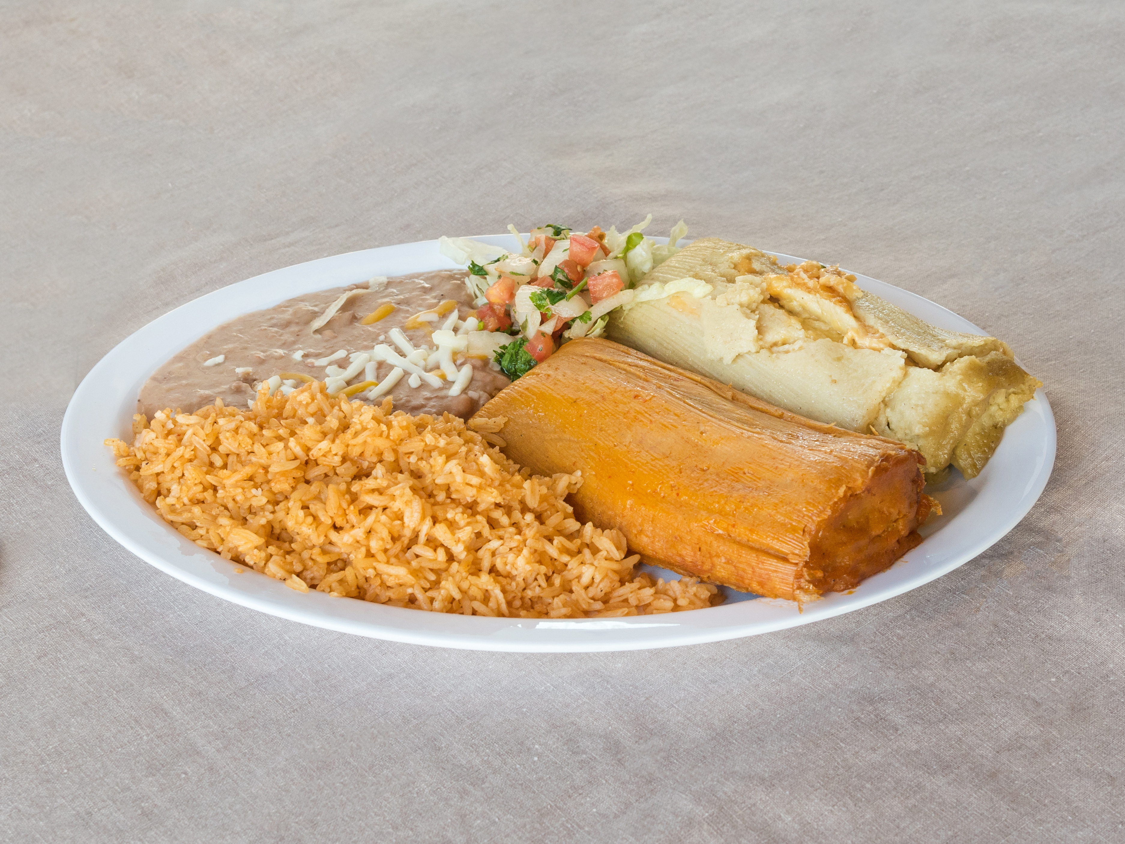 Order 2 Tamales Combo food online from Mamis Mexican Grill store, Eugene on bringmethat.com