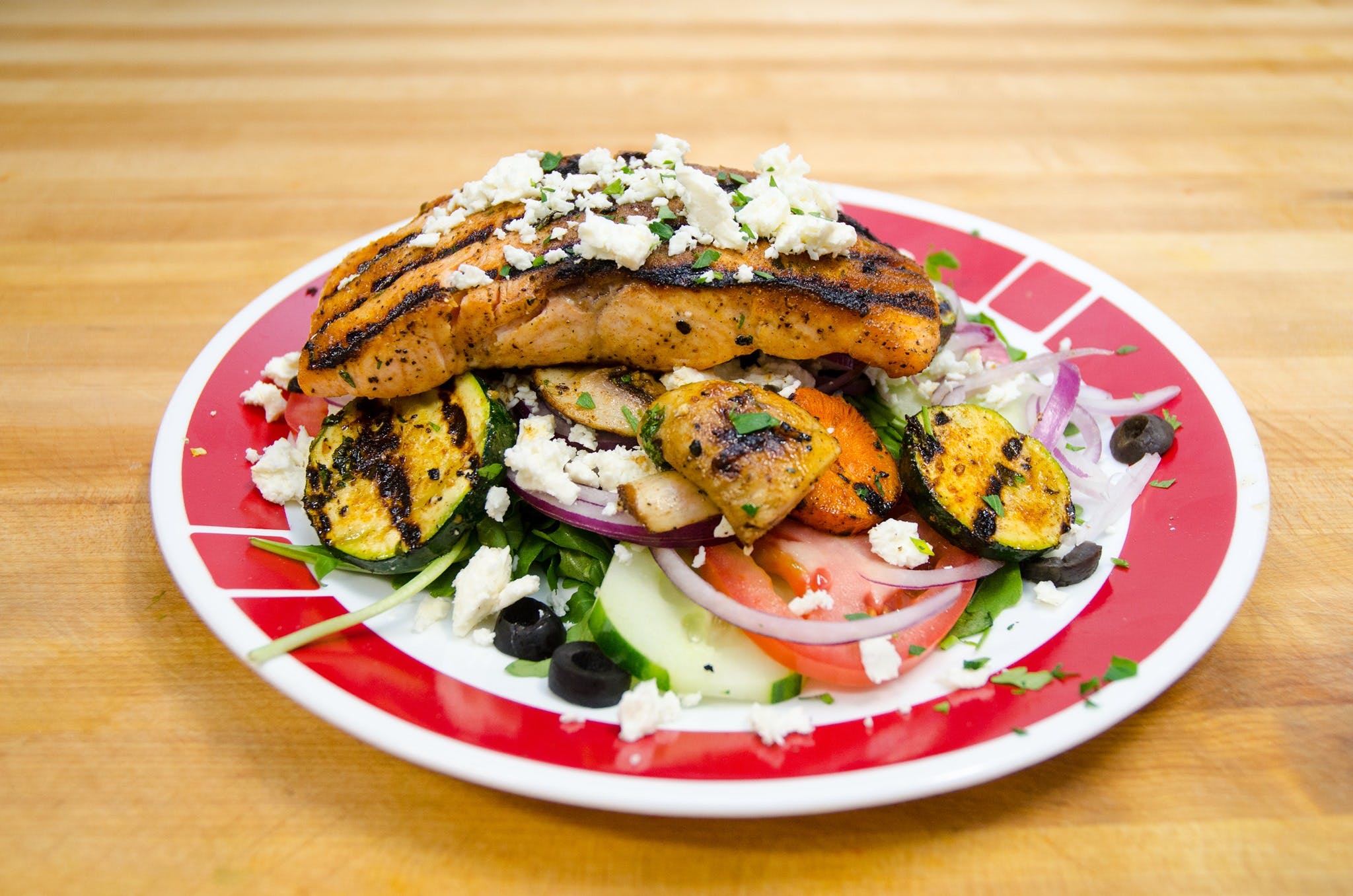 Order Grilled Salmon Salad - Large food online from Ray's pizza & restaurant store, Tallman on bringmethat.com