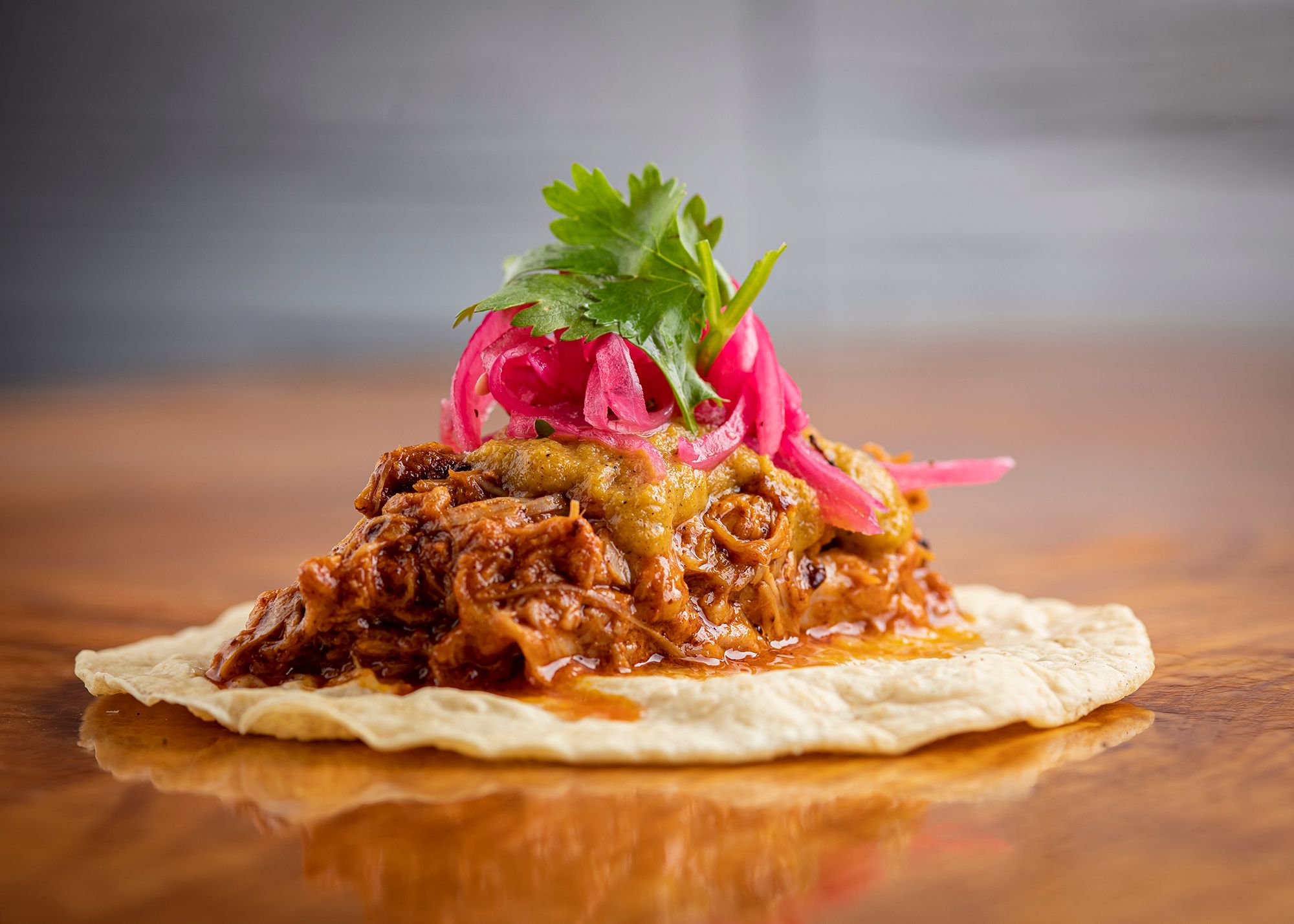 Order 2 Cochinita Pibil Tacos food online from El Taco Azteca store, Chicago on bringmethat.com