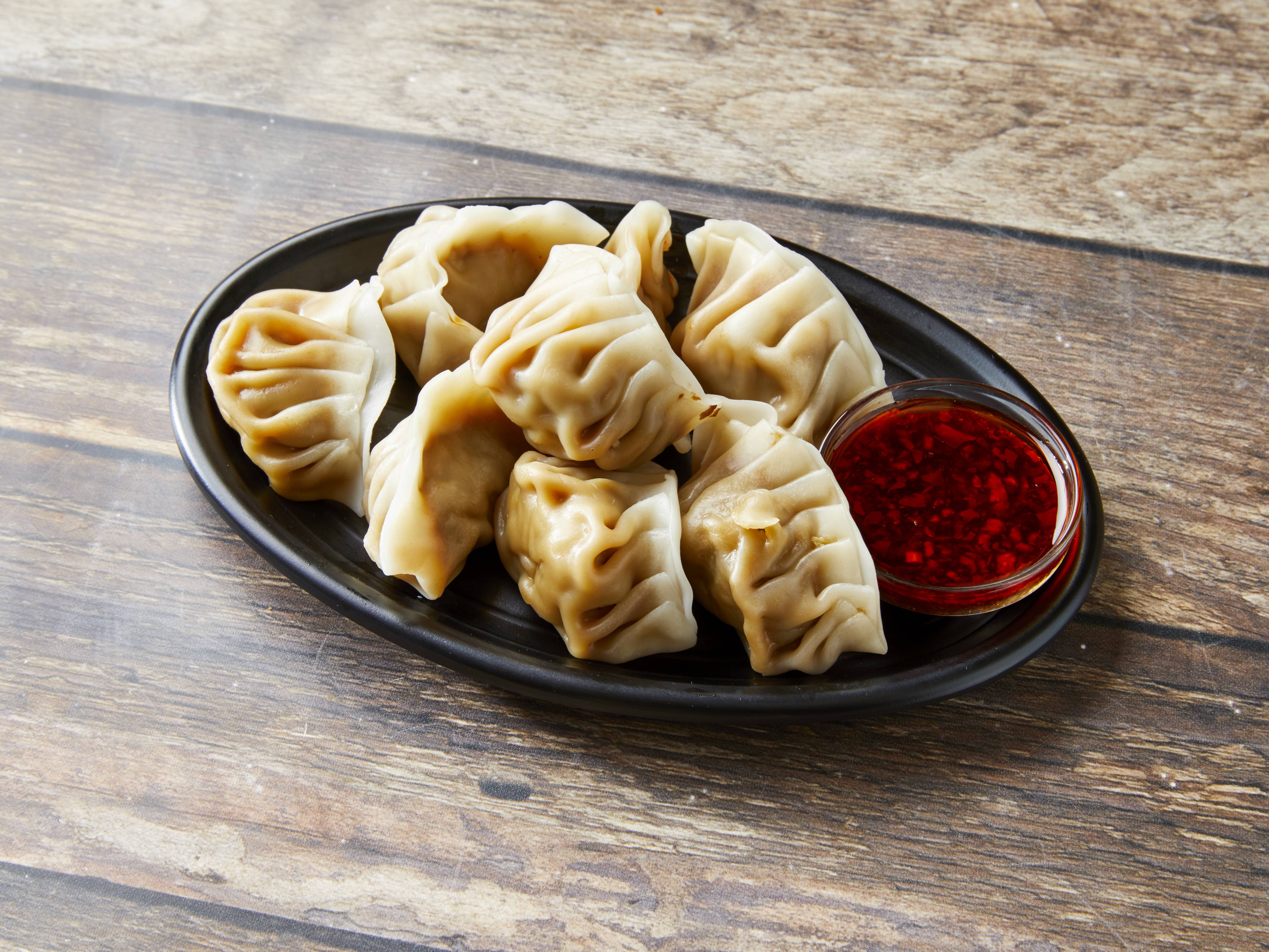 Order 18. Steamed Dumplings food online from New China One store, Detroit on bringmethat.com