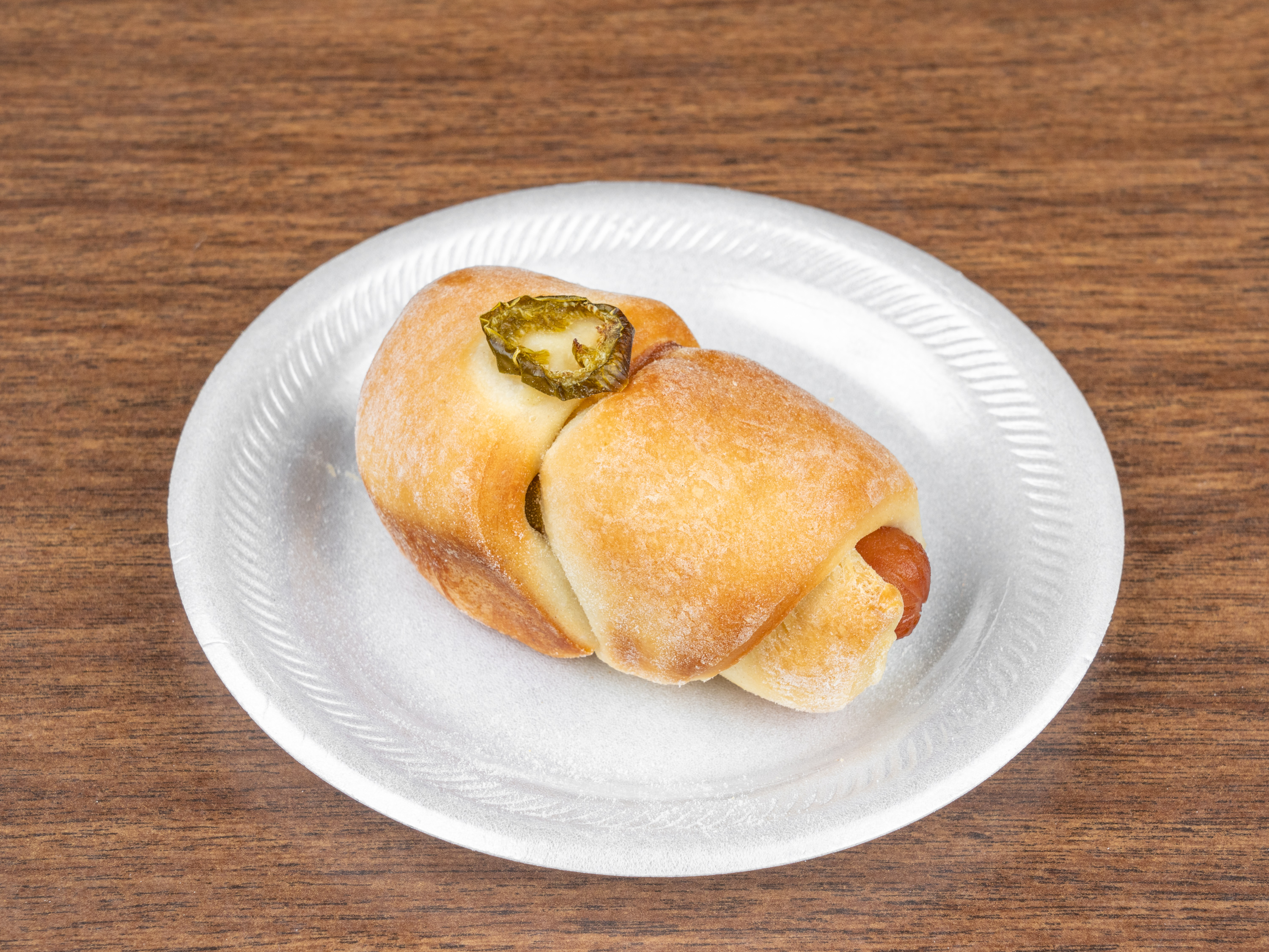 Order 1 Piece Sausage, Cheese and Jalapeno Kolache food online from Cinnamon's Bakery store, Sugar Land on bringmethat.com
