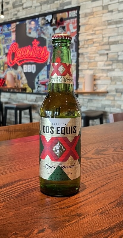 Order Dos Equis Lager, 12 oz bottle beer (4.2% ABV) food online from Cousin Barbq store, Crowley on bringmethat.com