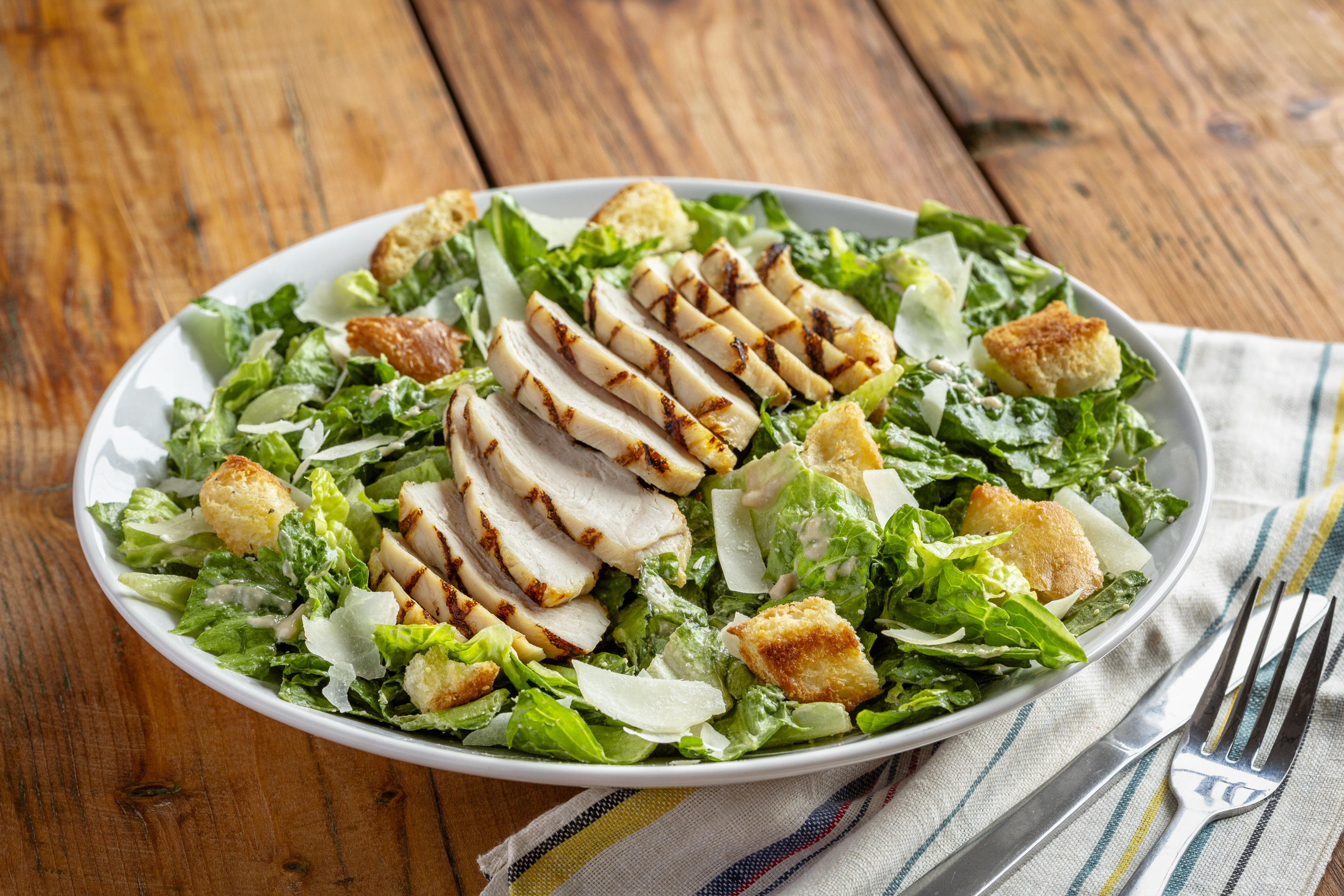 Order Caesar Salad food online from Uno Chicago Grill store, Frederick on bringmethat.com