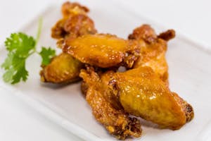 Order 07. Honey Glazed Chicken Wings (6 pcs) food online from Triple Crown Restaurant store, Chicago on bringmethat.com