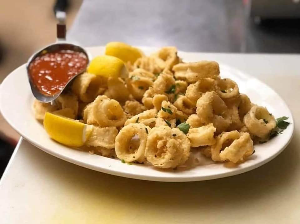 Order Fried Calamari - Appetizer food online from Gino's Pizzeria store, Staten Island on bringmethat.com