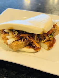 Order Lotus Bun (Bao Bun) with Fried tofu (Vegetarian) food online from Jade Garden store, Lawrence on bringmethat.com