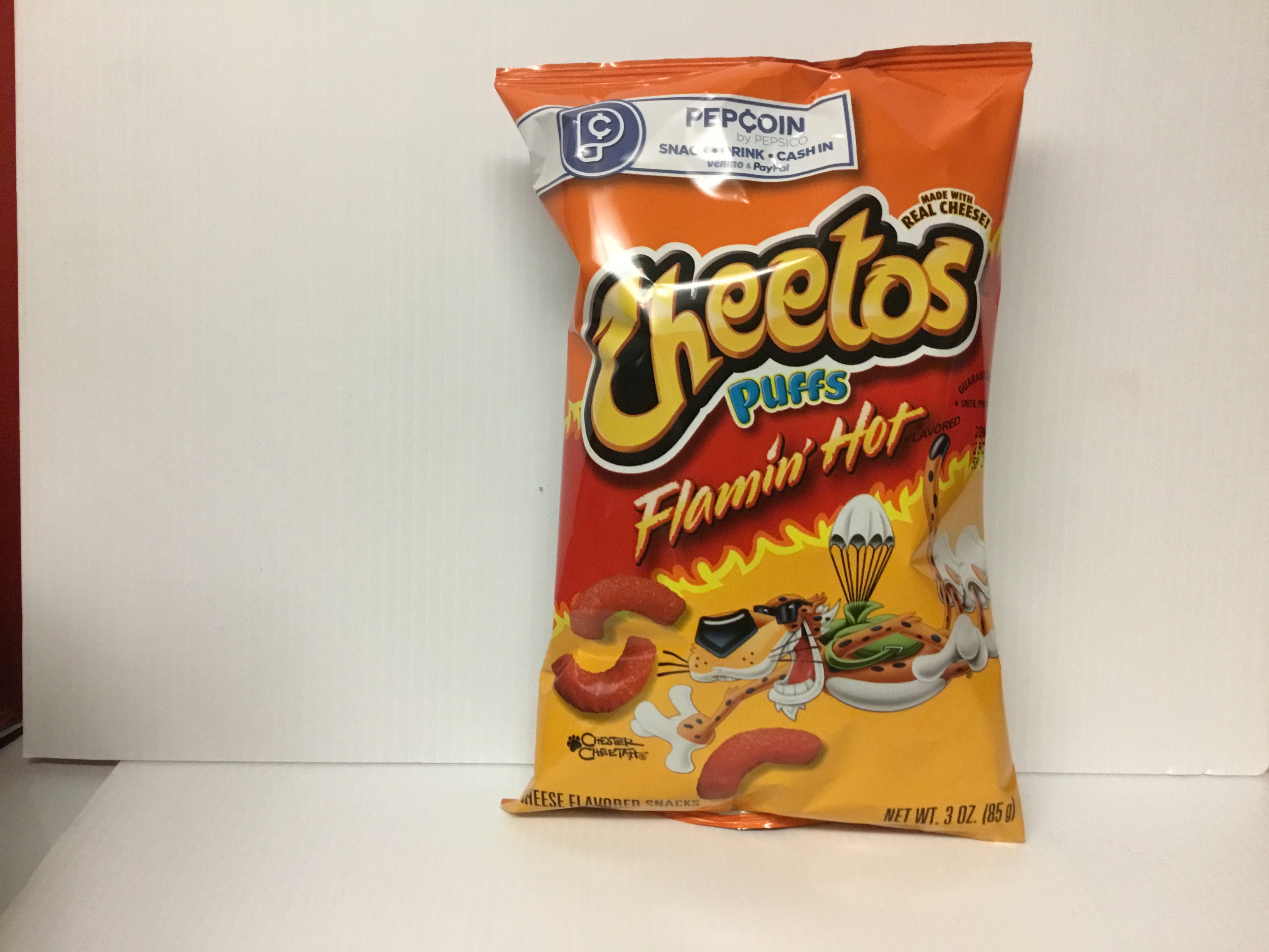Order Cheetos Puffs Flamin Hot 3 oz food online from Just Dash It store, Englewood on bringmethat.com
