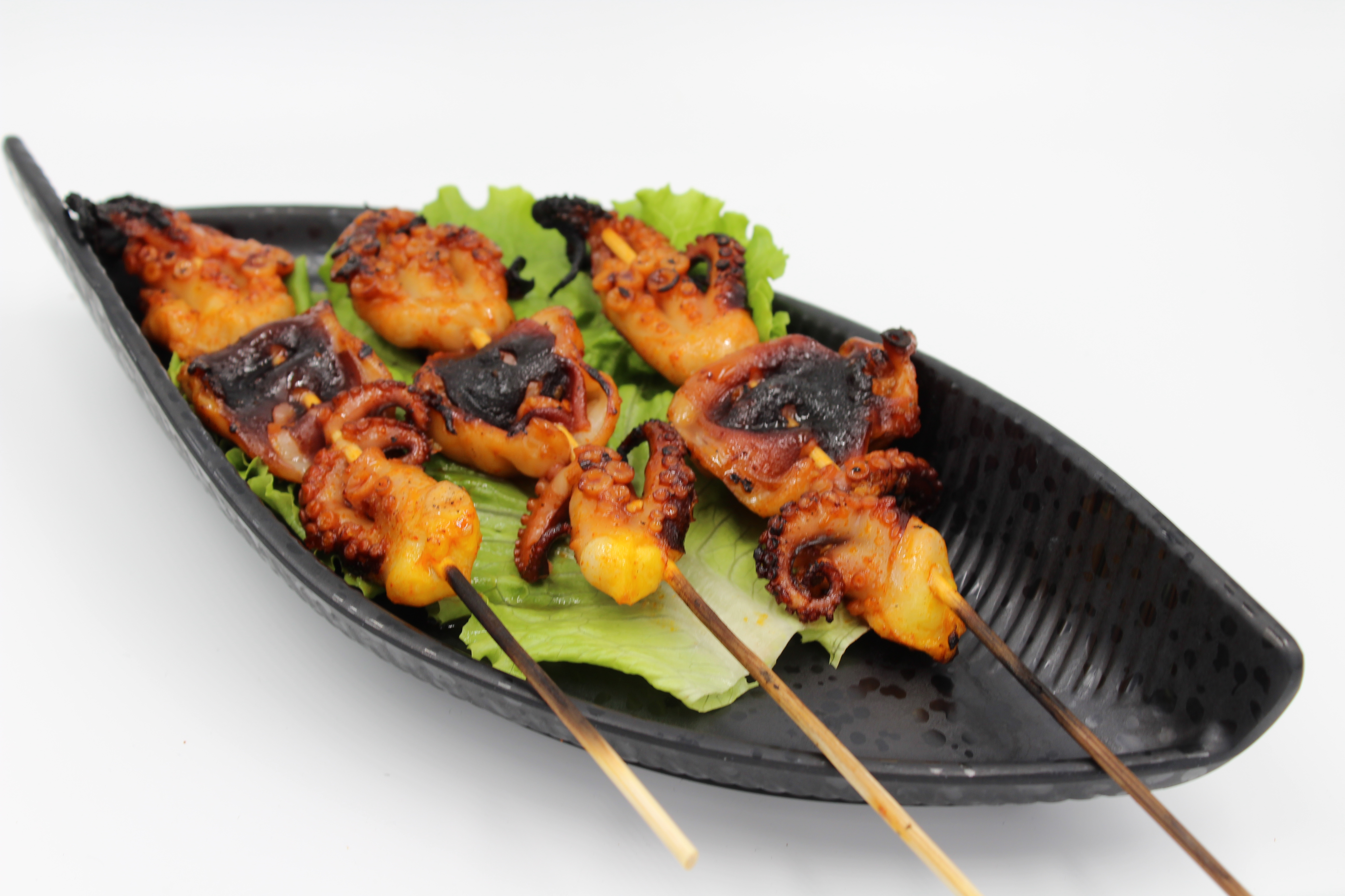 Order A14. Spicy charred baby octopus skewers.  food online from Watda Pho store, Englewood on bringmethat.com