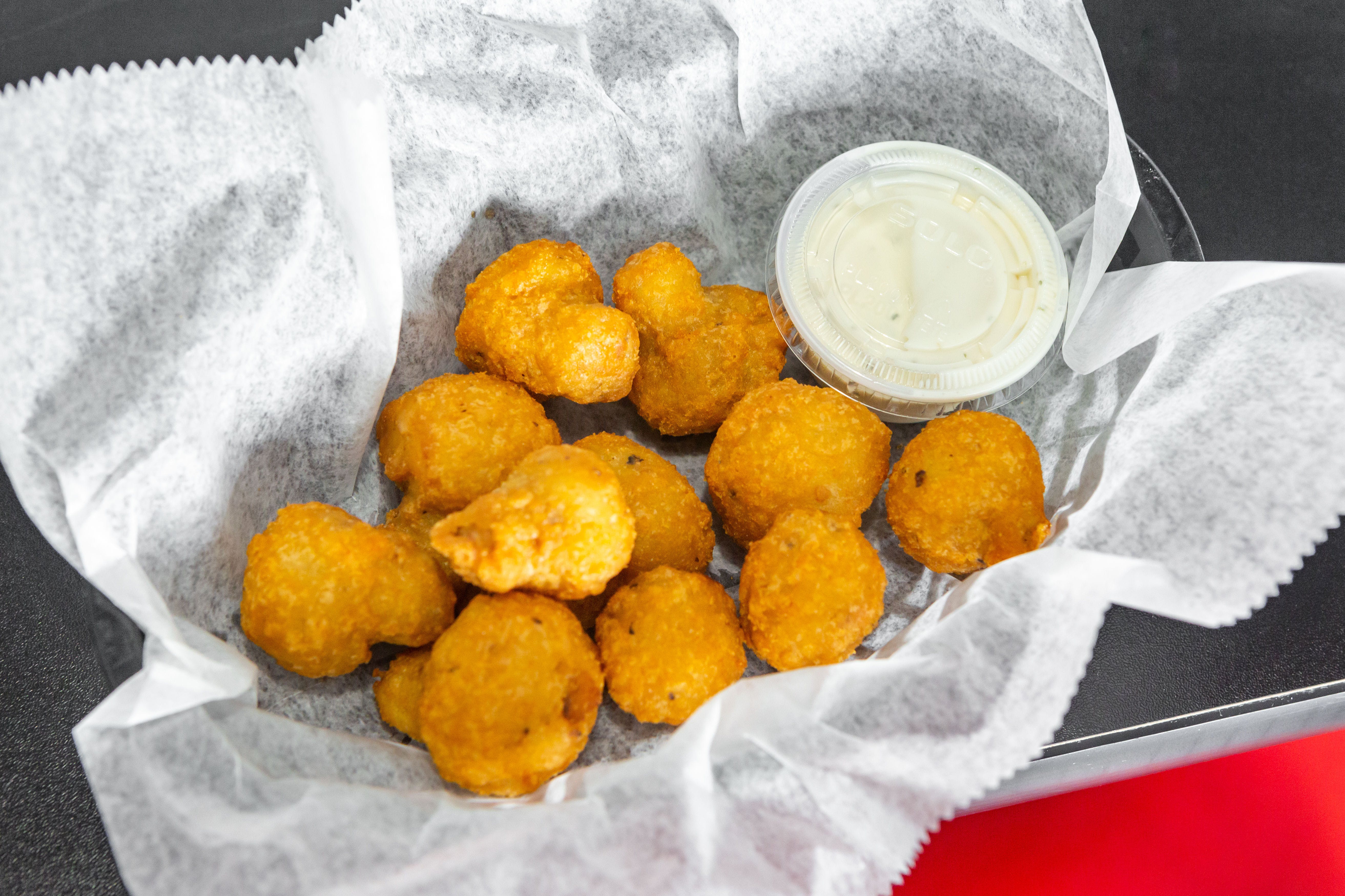 Order Breaded Mushrooms - Appetizer food online from Tangy Tomato store, Syracuse on bringmethat.com