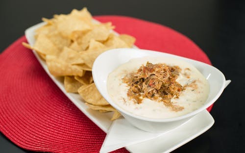 Order Shredded Pork Queso Dip - Appetizer food online from Native Grill & Wings store, Phoenix on bringmethat.com
