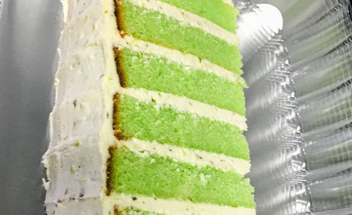 Order 6 Layer Key Lime Cake Slice food online from RVA Cafe store, Henrico on bringmethat.com